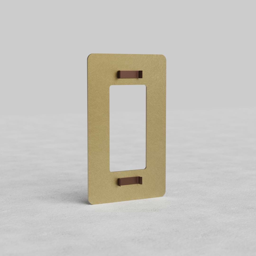 Antique Brass 1G Outlet Plate Kew US with central cutout, shown upright on a light textured surface.
