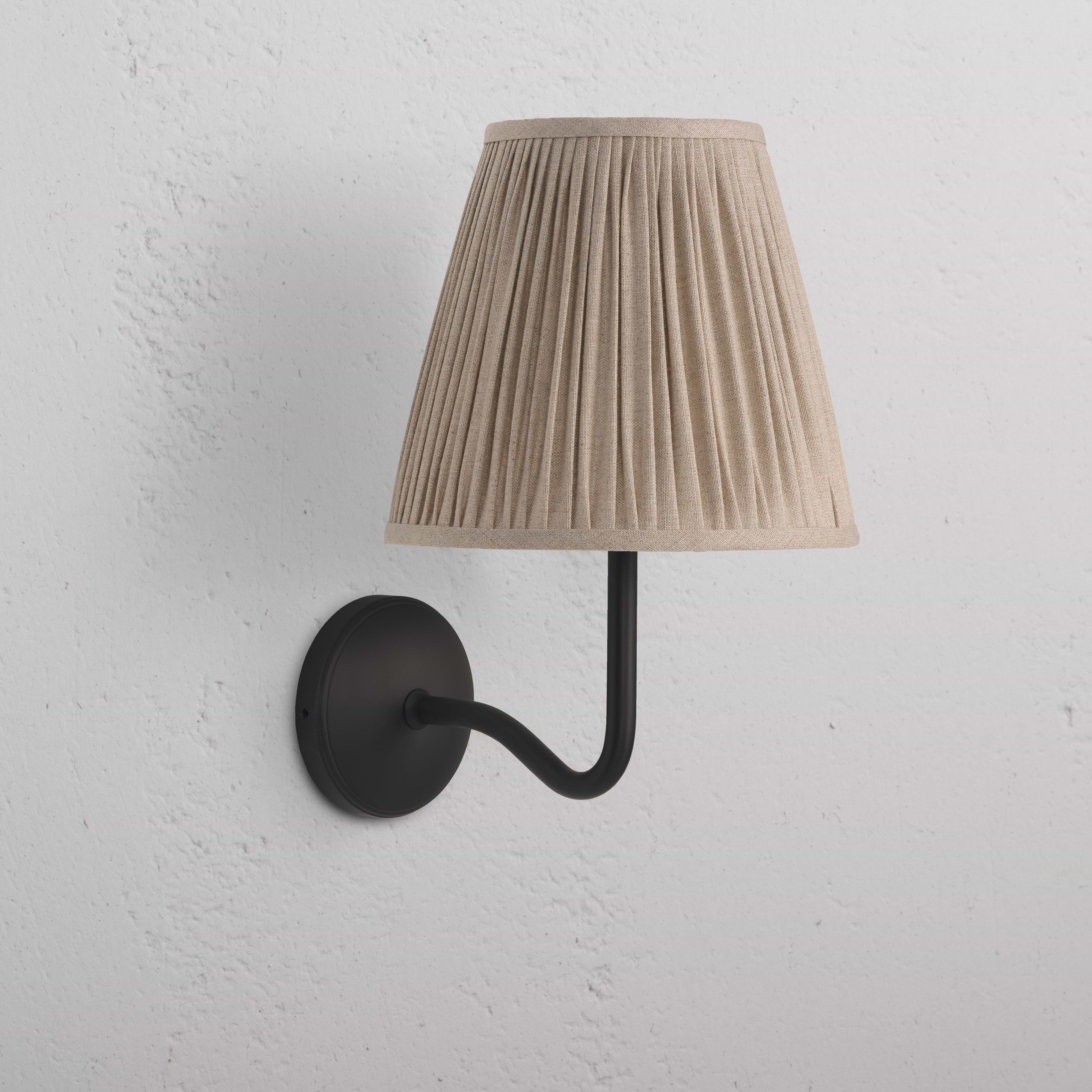 Large Malvern Wall Light in natural beige with a pleated fabric shade and bronze wall-mounted arm and base.