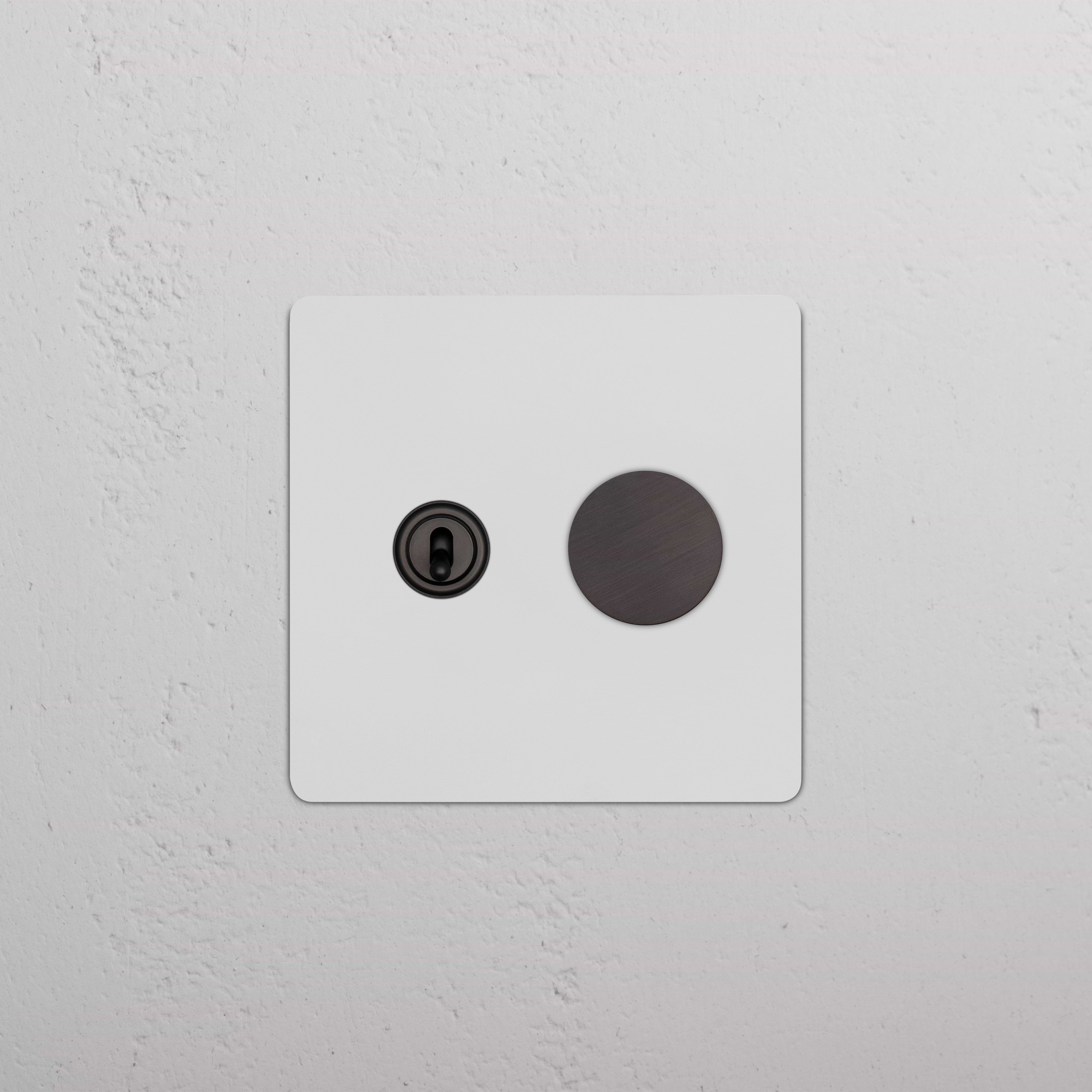 Kew 2G Toggle & Dimmer Switch in paintable bronze finish, with toggle and dimmer controls on wall plate.