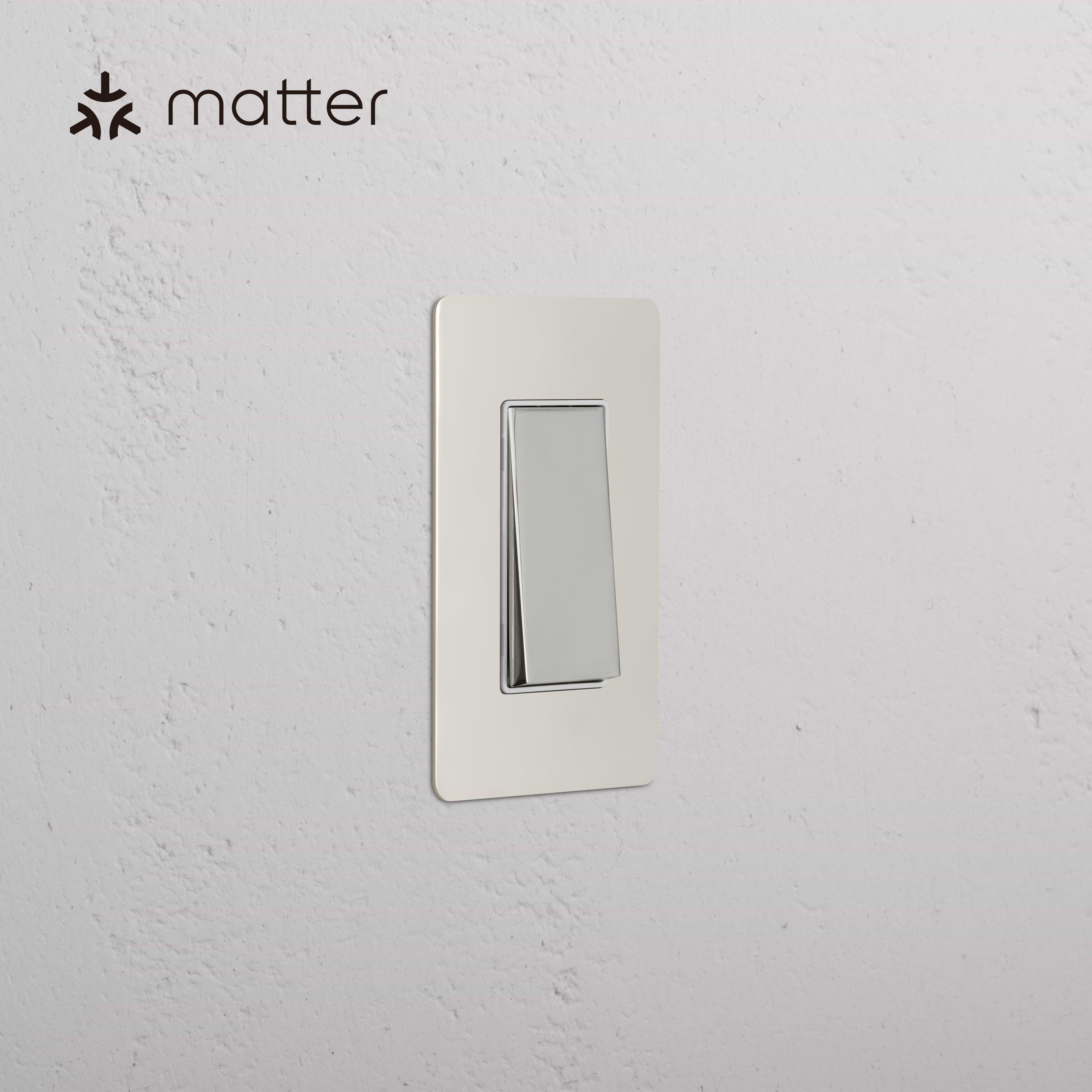 Kew 1G Smart Retractive Rocker Switch in Polished Nickel White mounted on textured white wall, Matter logo shown.