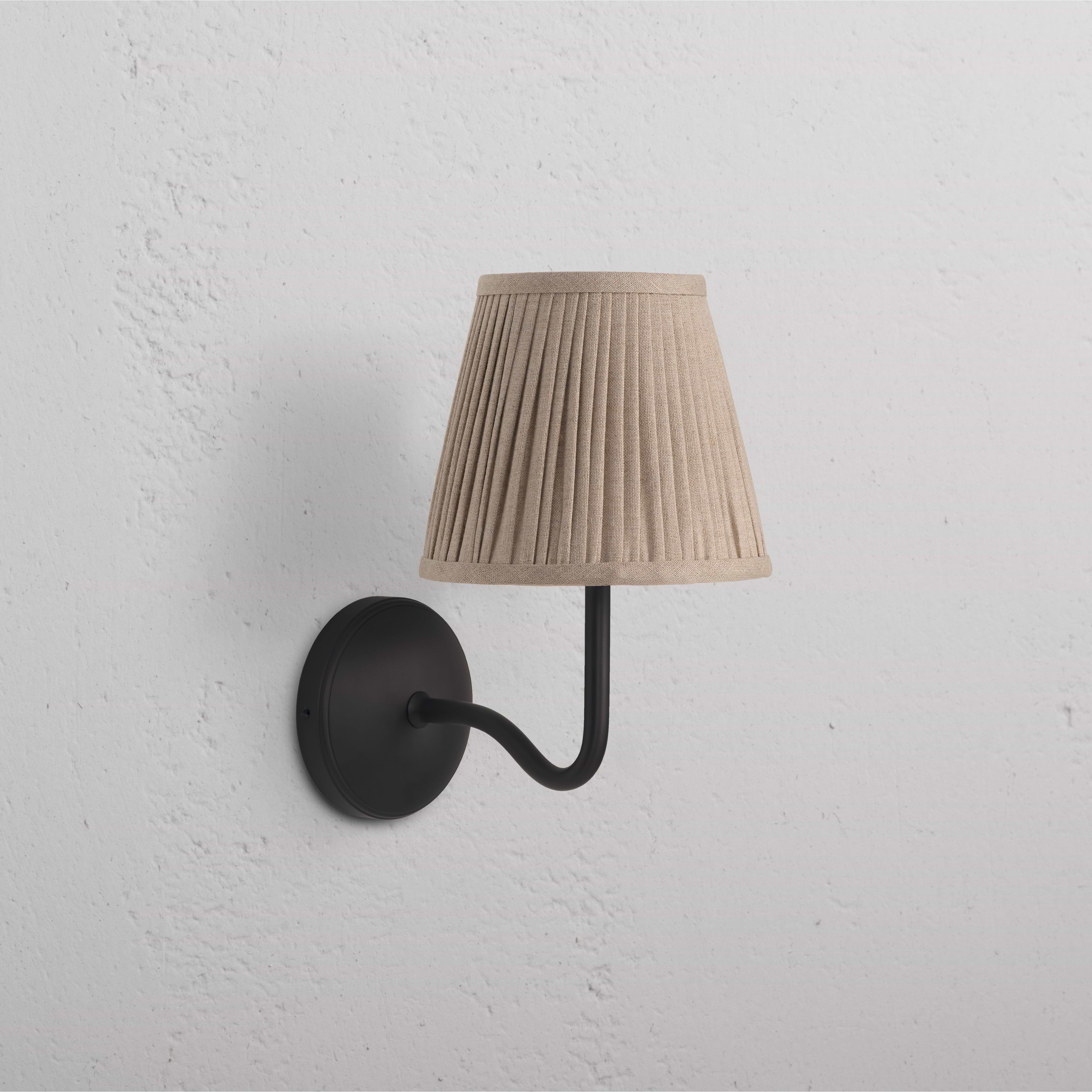 Malvern Medium Wall Light in Natural Beige with bronze arm and base, pleated beige shade mounted on wall.