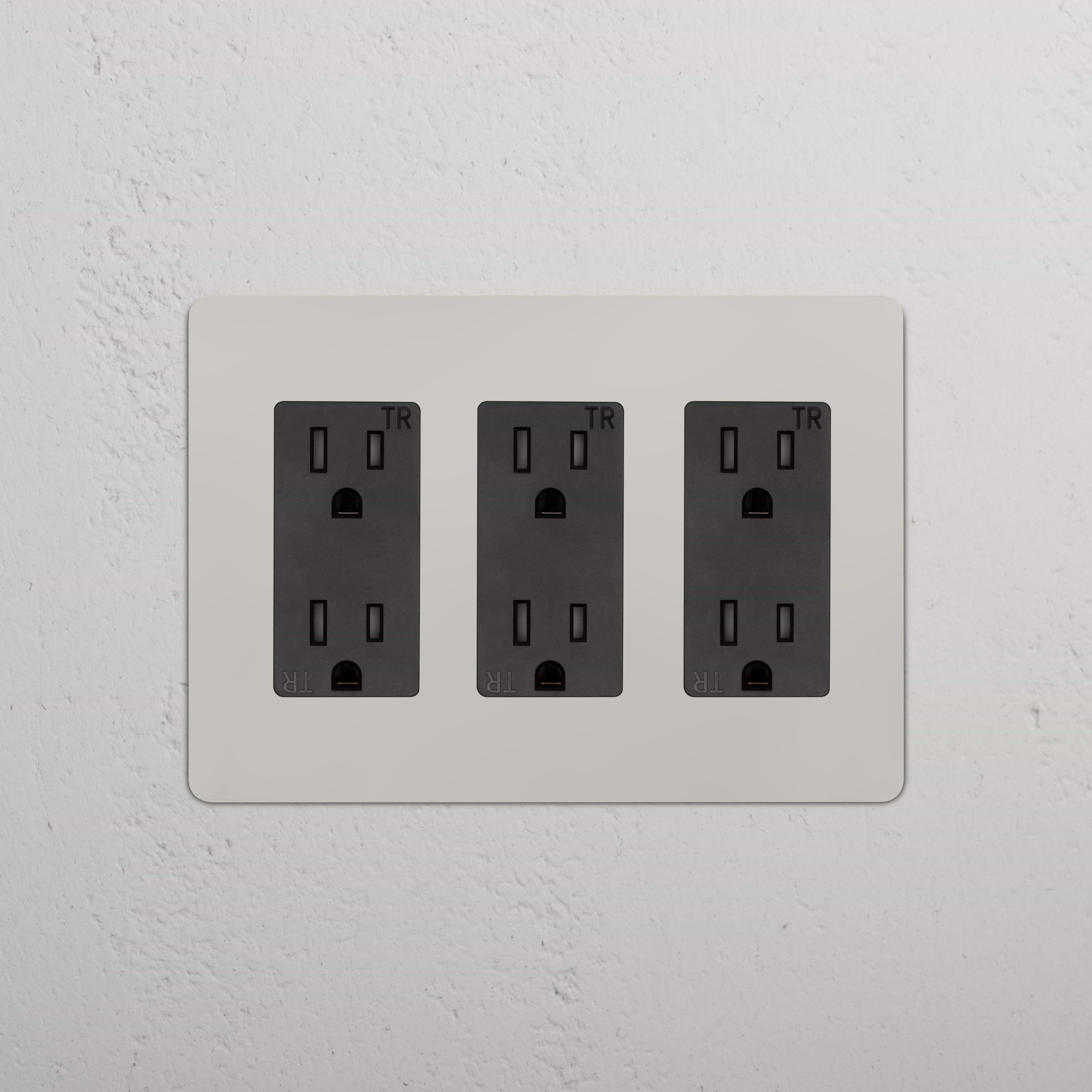 Kew 3G Outlet in Polished Nickel Black with three black sockets on a sleek wall plate.