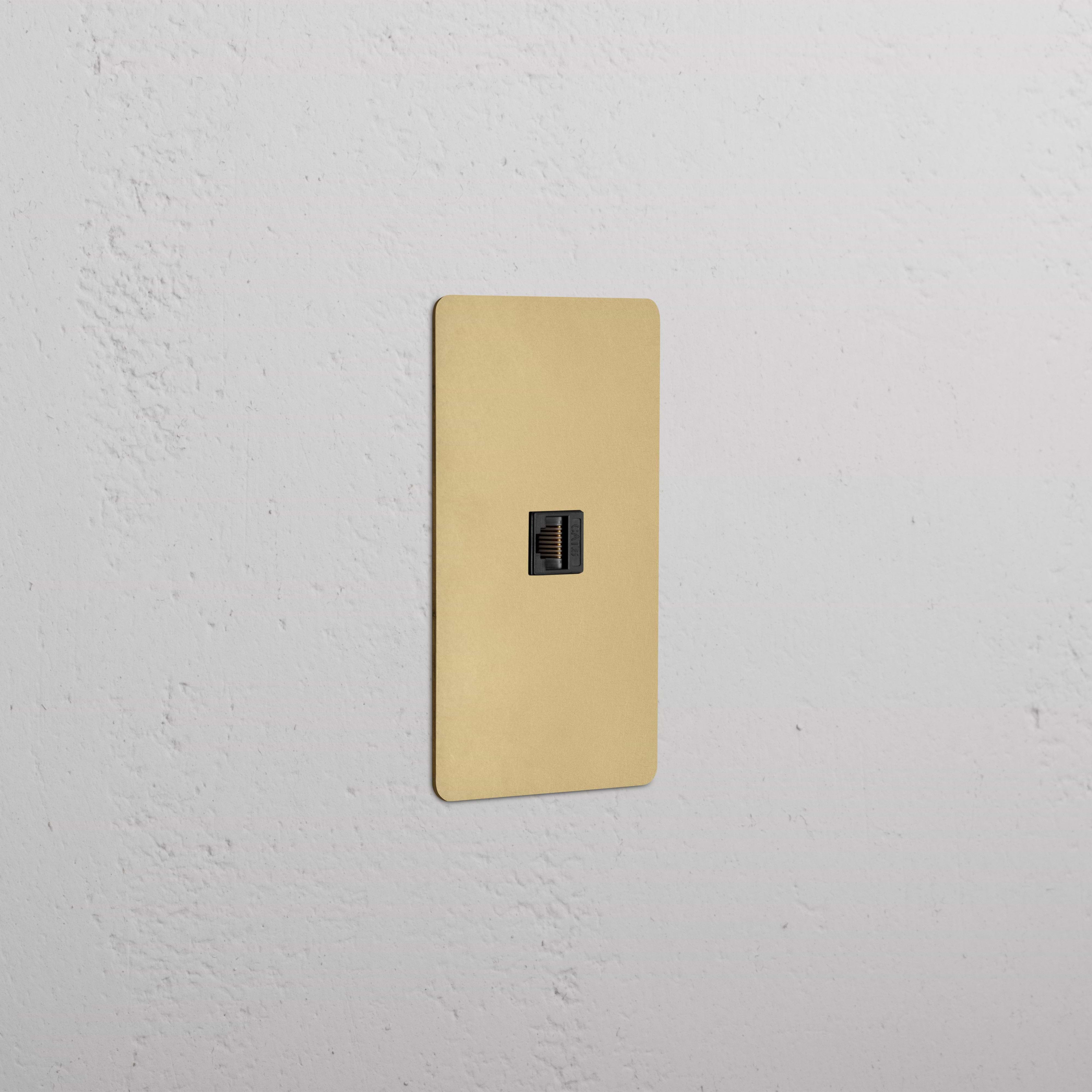 Kew 1G CAT 6 Keystone Ethernet port with antique brass black faceplate, mounted on a white wall.