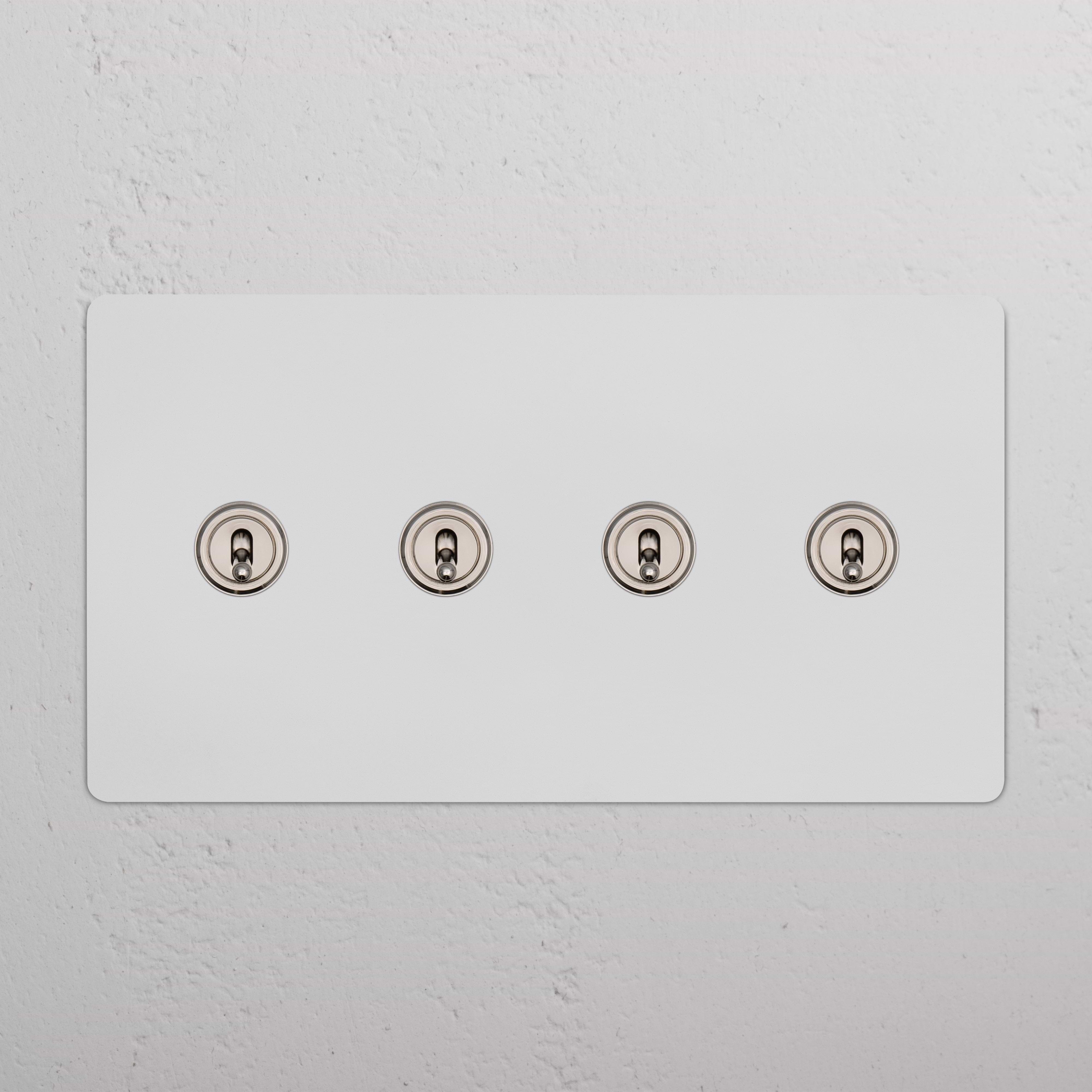Kew 4G Toggle Switch in paintable polished nickel with four horizontal toggles on a rectangular panel.