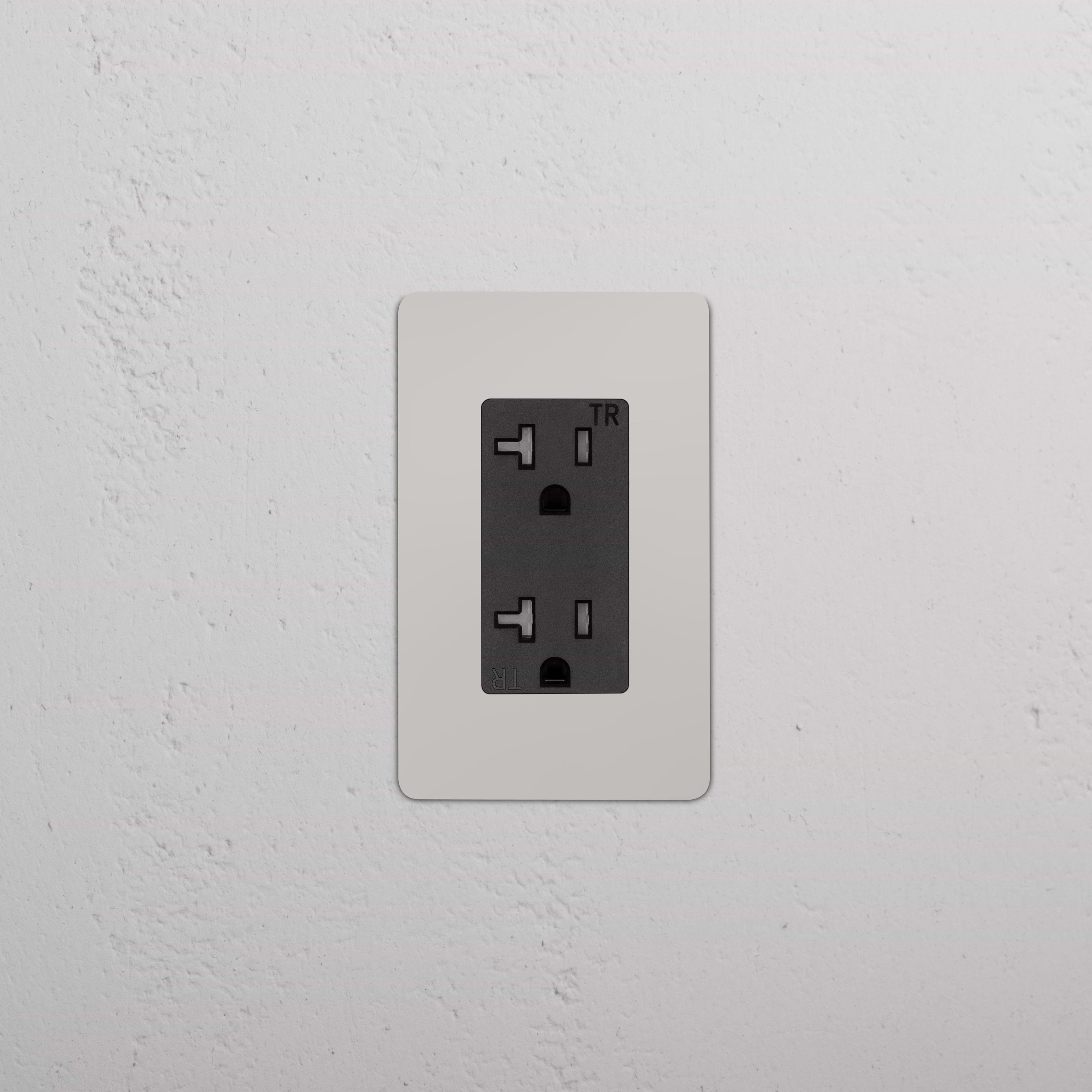 Kew 1G 20A Outlet in polished nickel black finish, single rectangular socket on a wall.