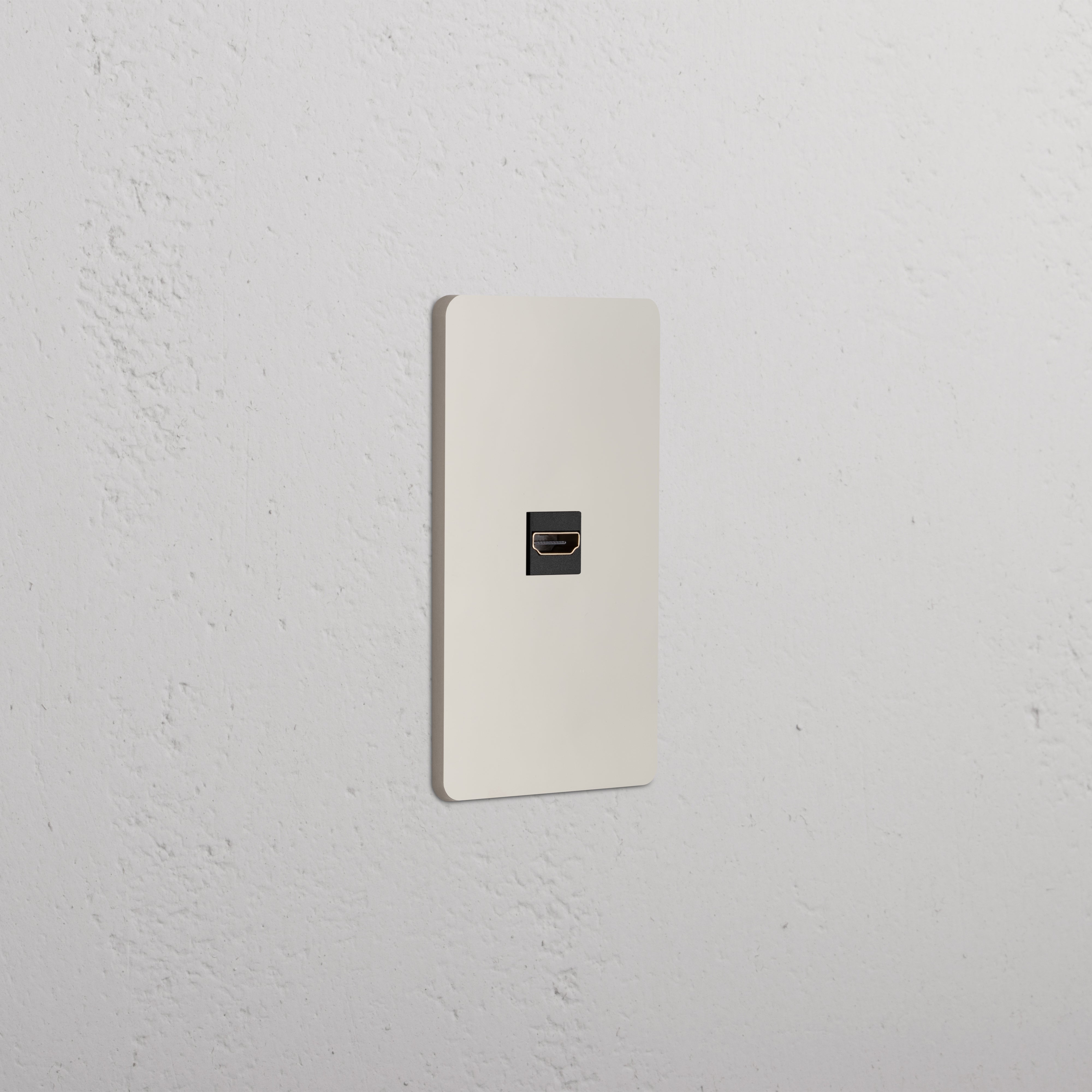 Grove 1G HDMI Keystone wall plate in Polished Nickel Black with a central HDMI port, mounted on a white wall.