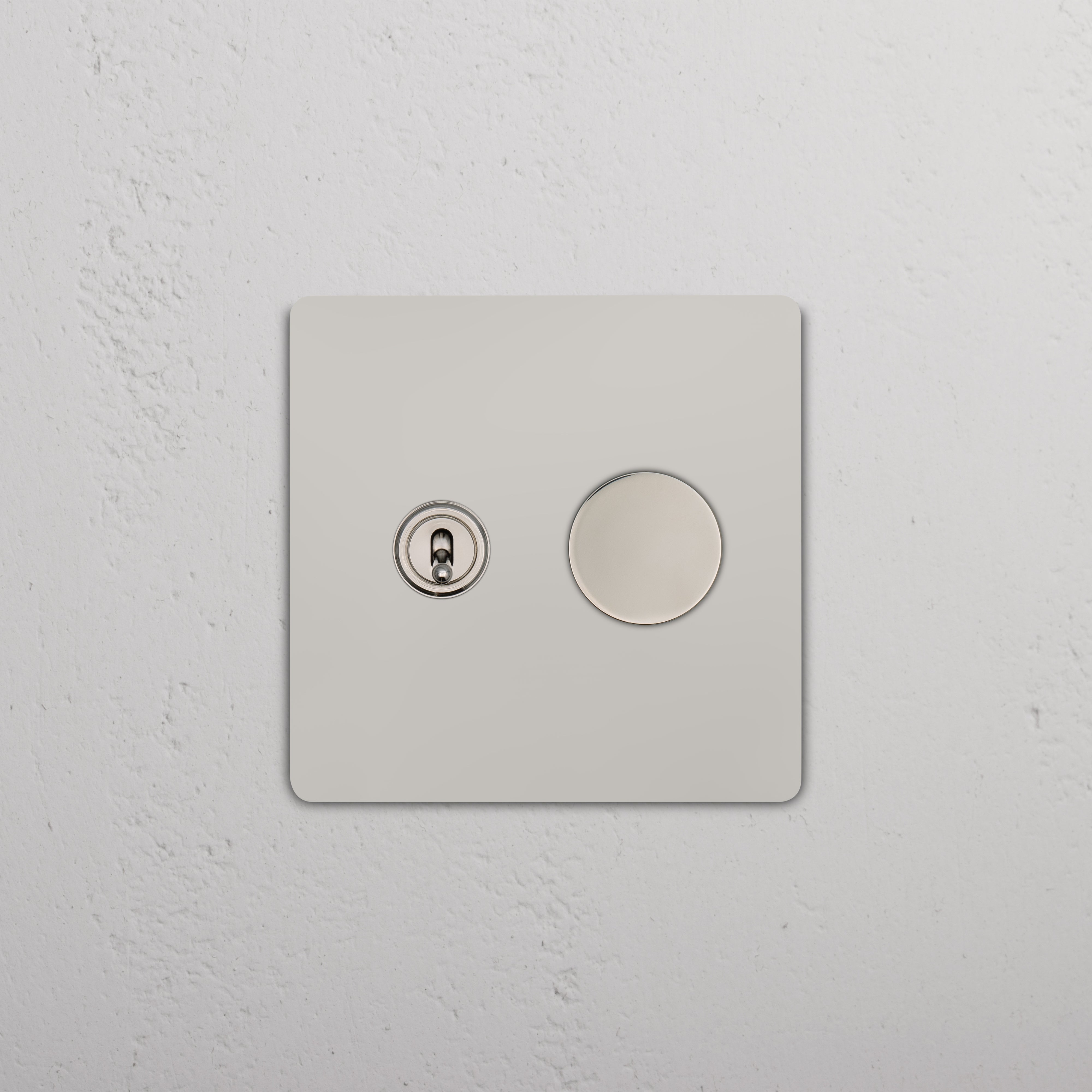Close-up of Grove 2G Toggle & Dimmer Switch in polished nickel, mounted on a square wall plate.