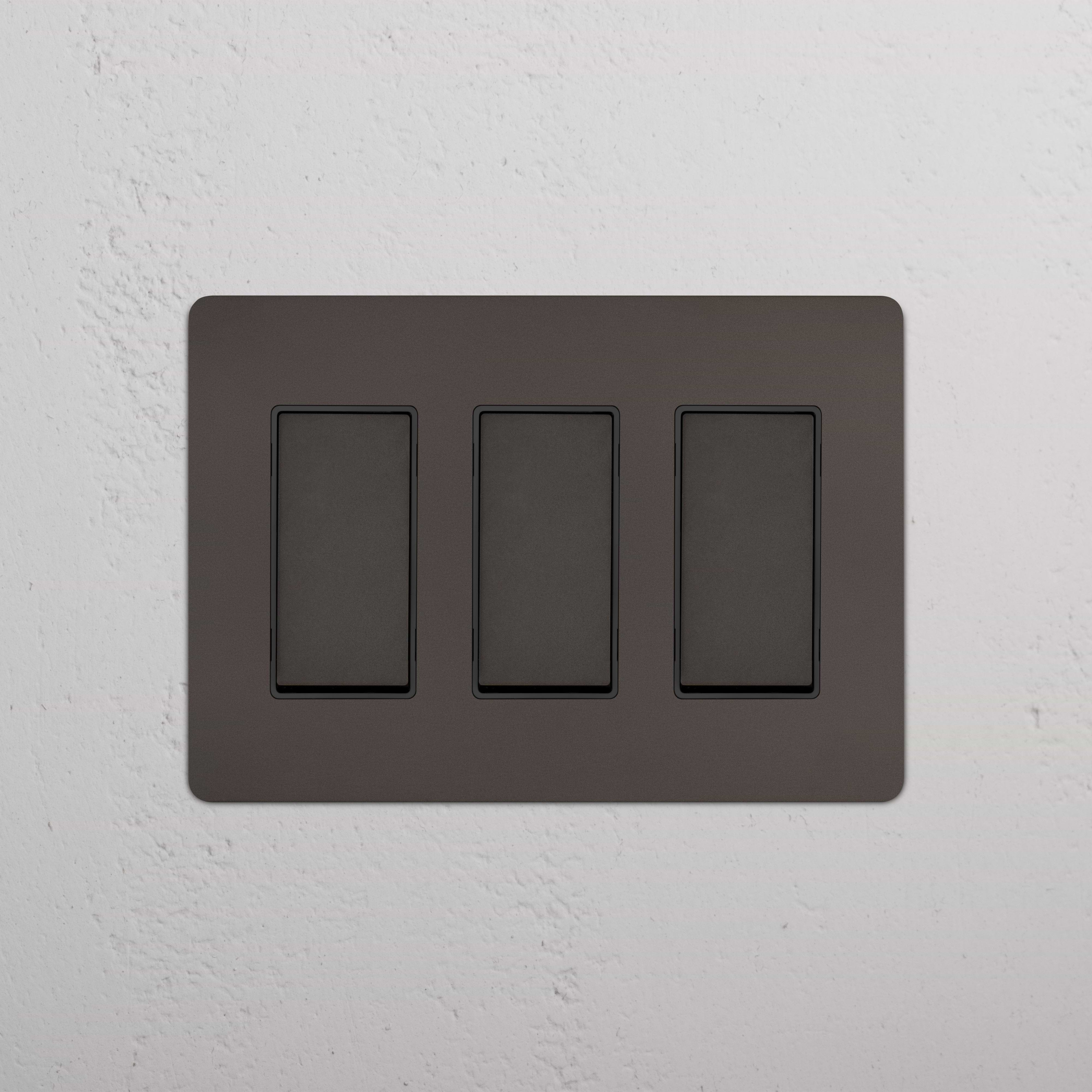 Kew 3G Rocker Switch in Bronze Black finish, shown mounted on a wall for electrical control use.