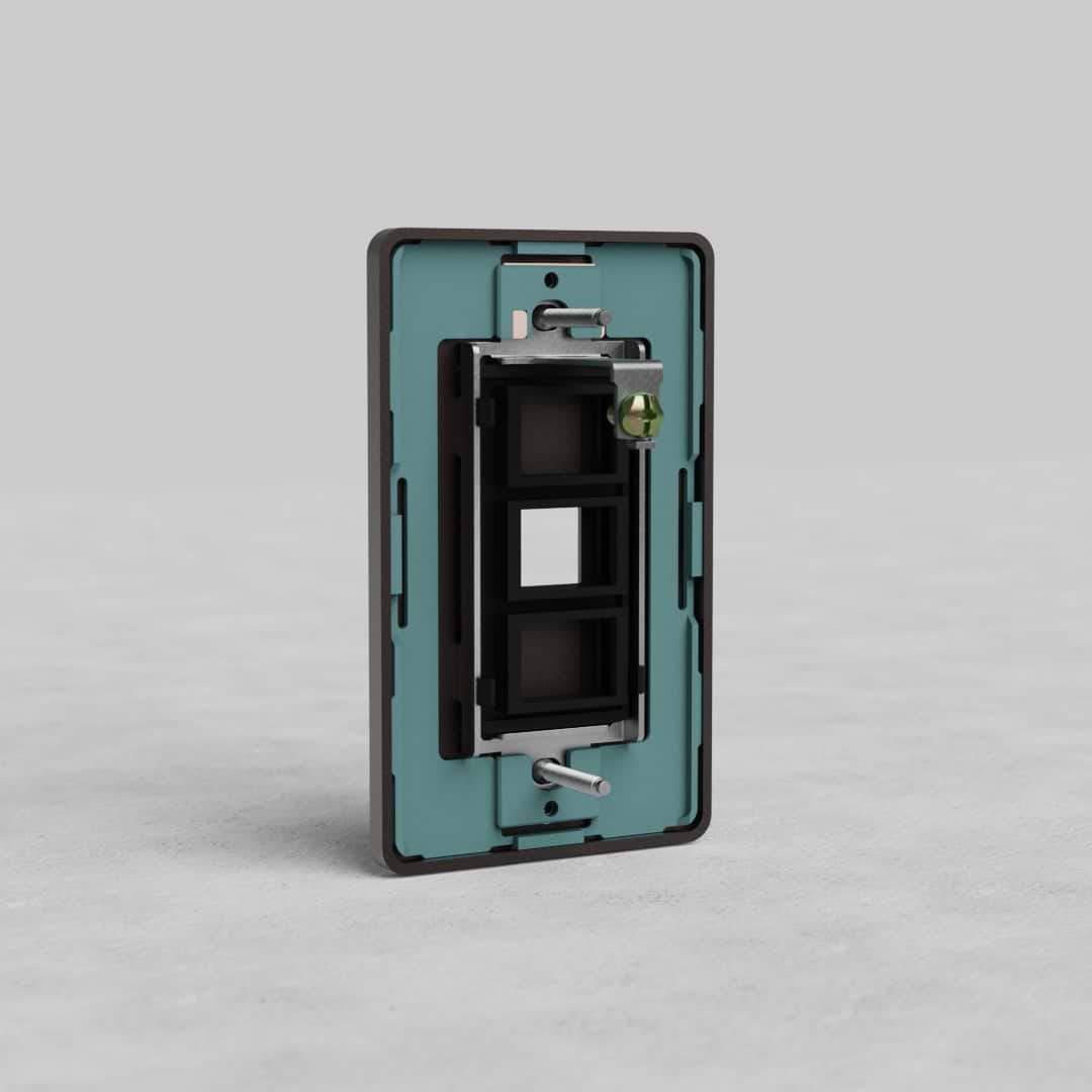 Bronze 1G Keystone Plate Grove US with rectangular cutout, black inner frame, and visible screws.