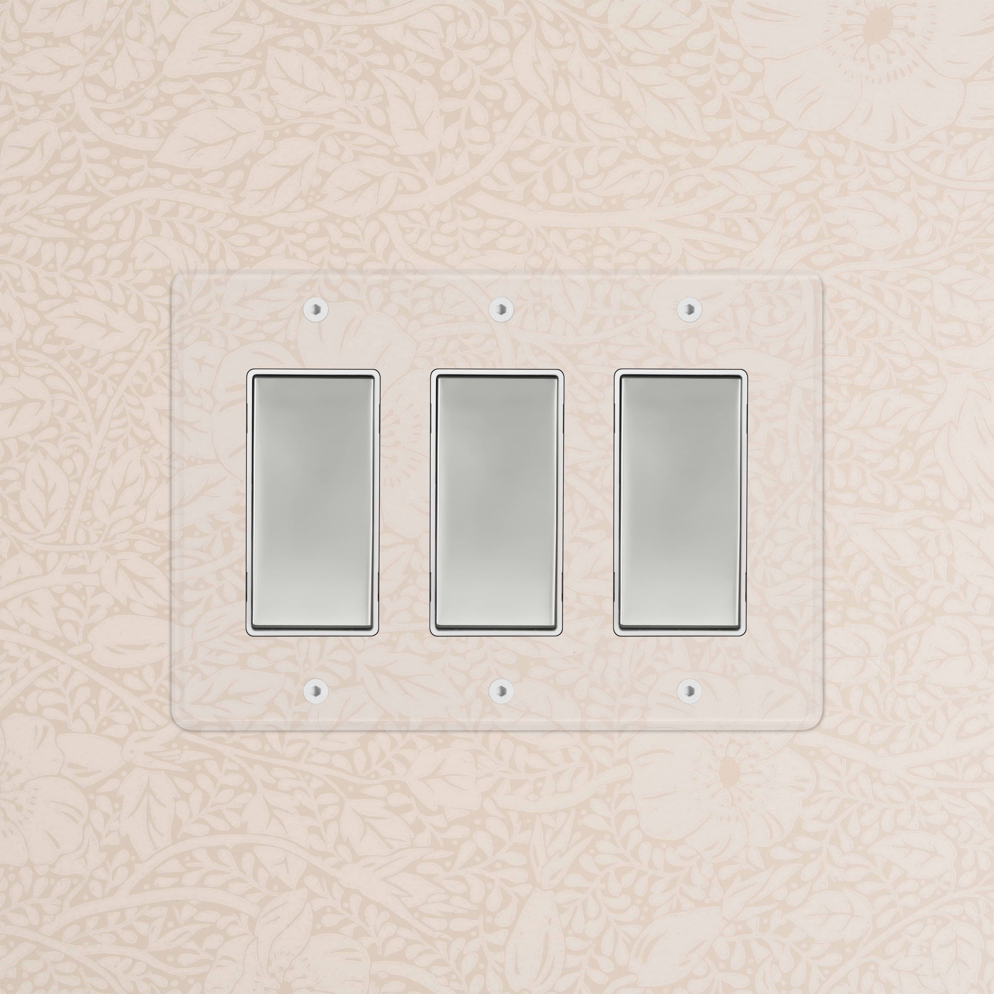 Kew 3G Rocker Switch in clear polished nickel with white finish, installed on a patterned beige wall.