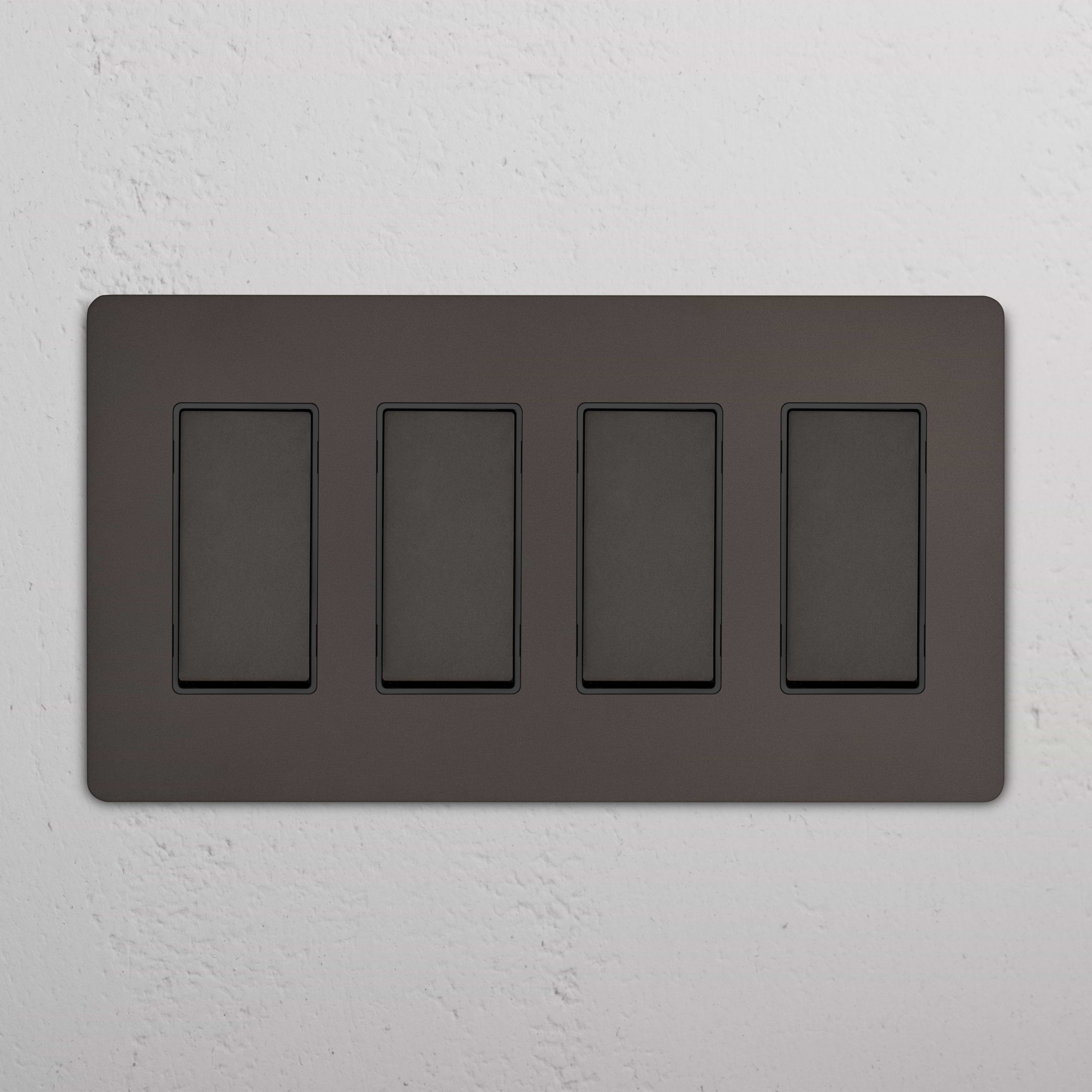 Grove 4G Rocker Switch in Bronze Black with four rectangular switches on a wall-mounted panel.