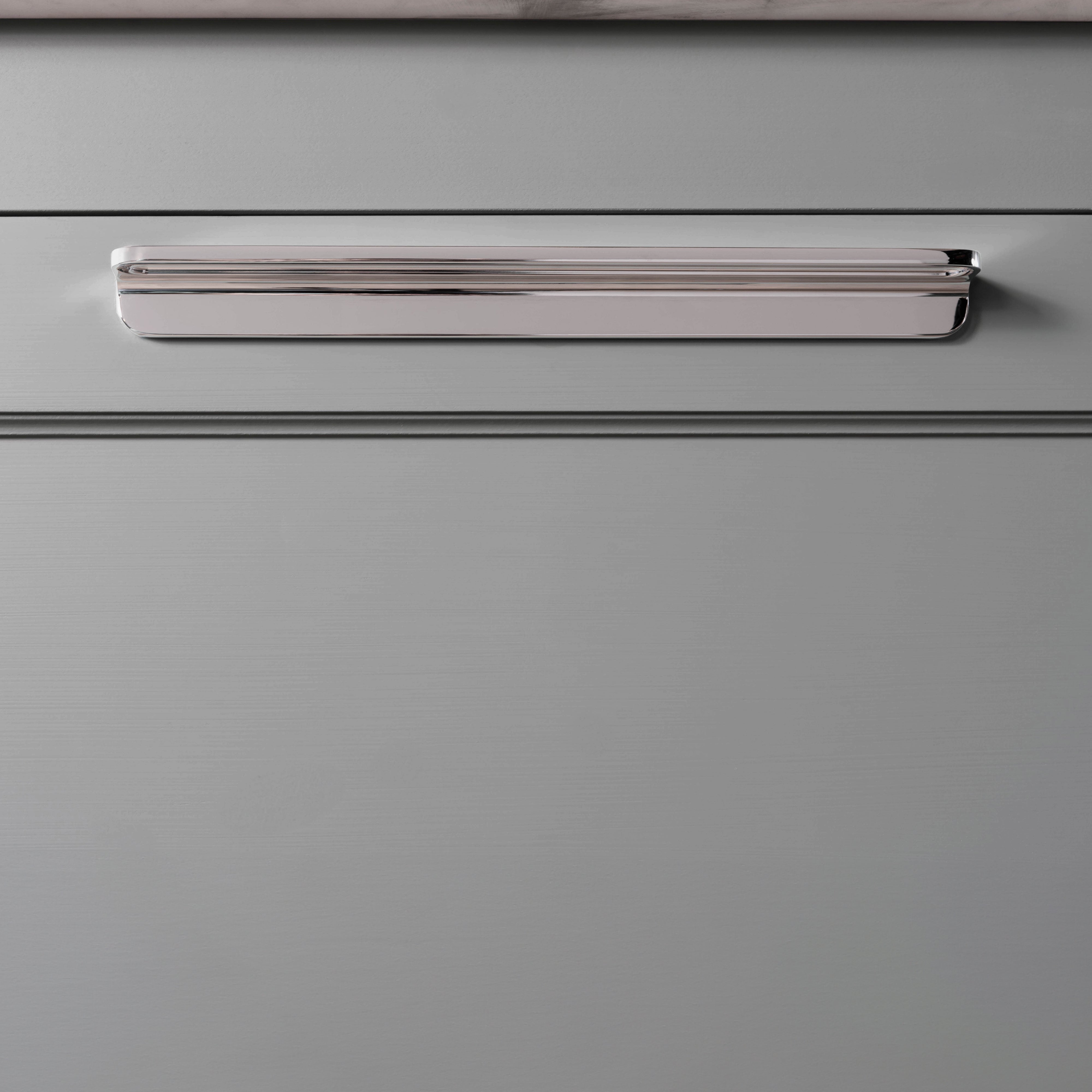 Close-up of the Oxford Furniture Handle Large in polished nickel, installed on a light gray drawer front.
