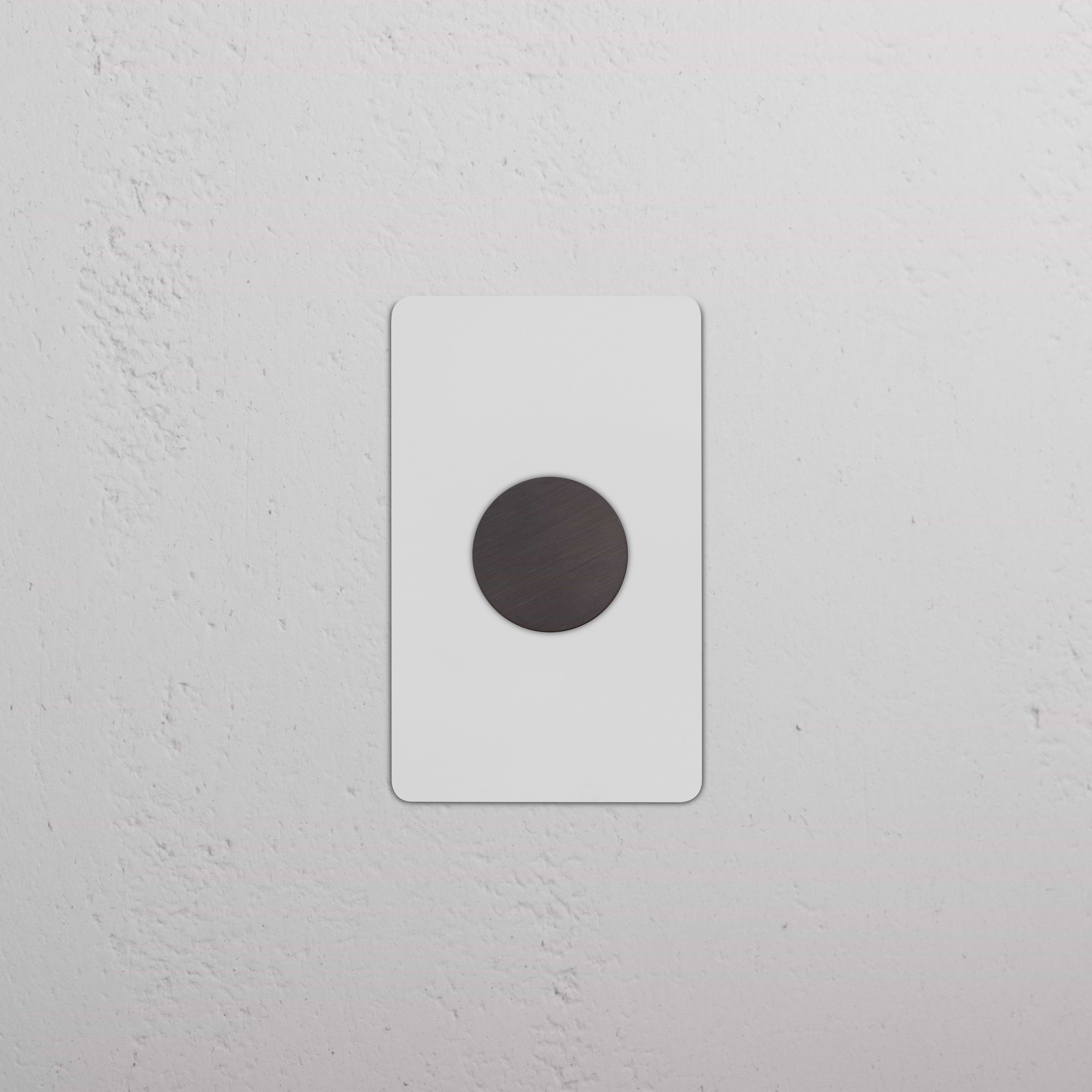 Kew 1G Dimmer Switch in paintable bronze, single rotary control on a rectangular wall plate.