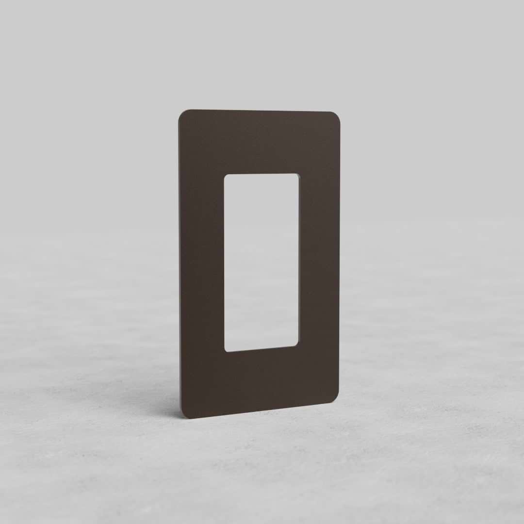 Rectangular bronze 1G outlet plate Kew US with a central cutout, shown upright on a light background.