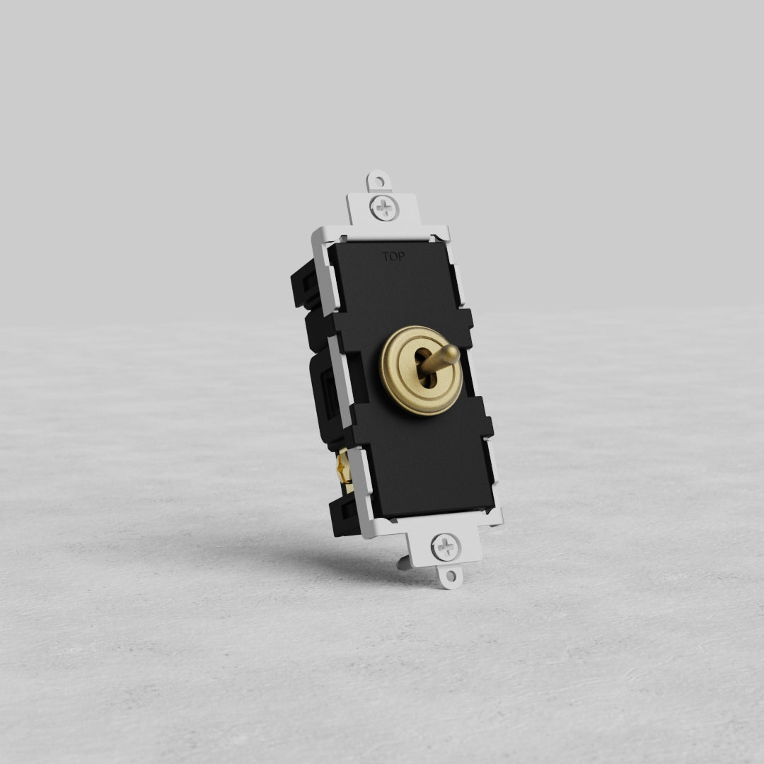 Center Retractive Toggle Switch in antique brass finish, shown upright on a light gray background.