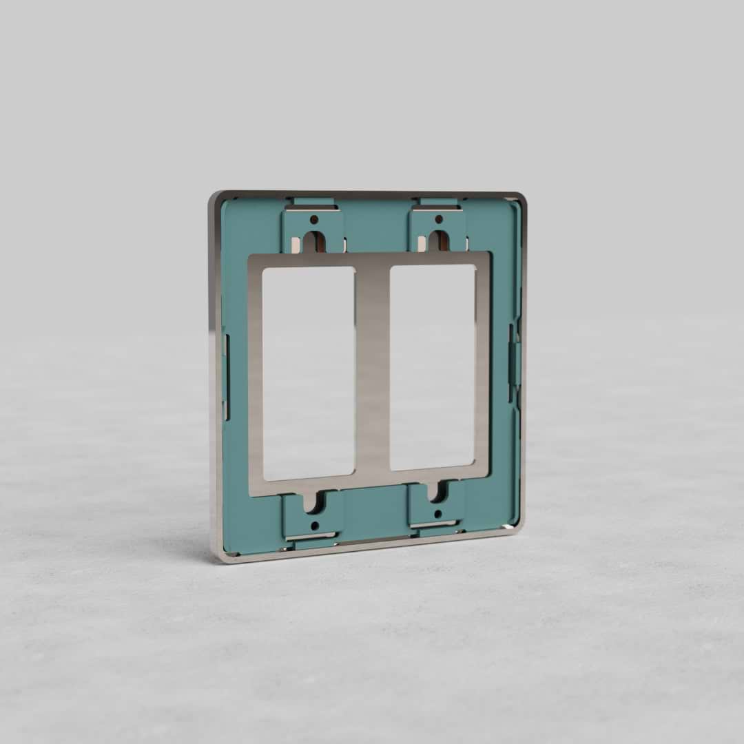 Polished nickel 2G Outlet Plate Grove US with two rectangular openings, shown on a light gray surface.