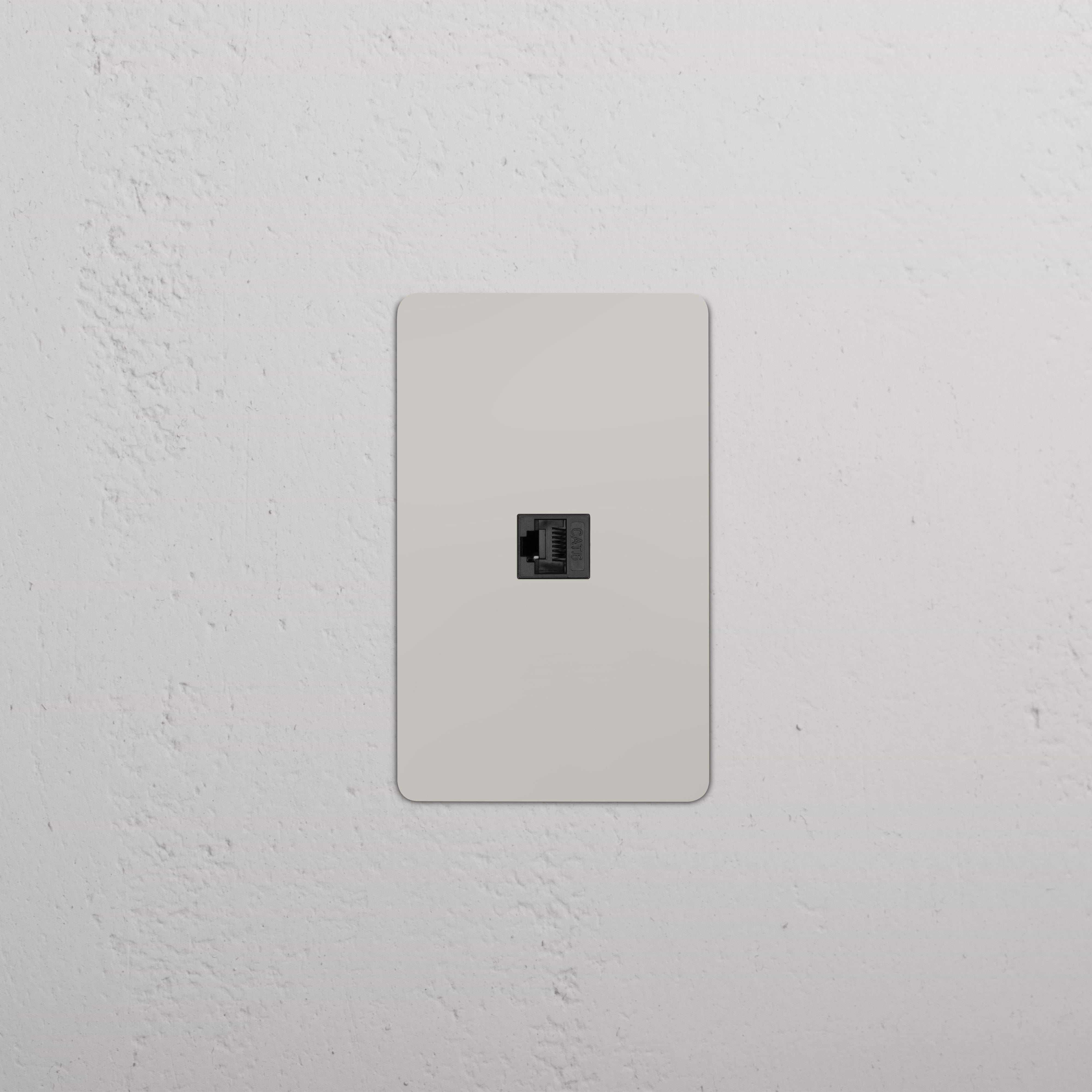 Kew 1G CAT 6 Keystone in polished nickel black, single Ethernet network wall jack on display.