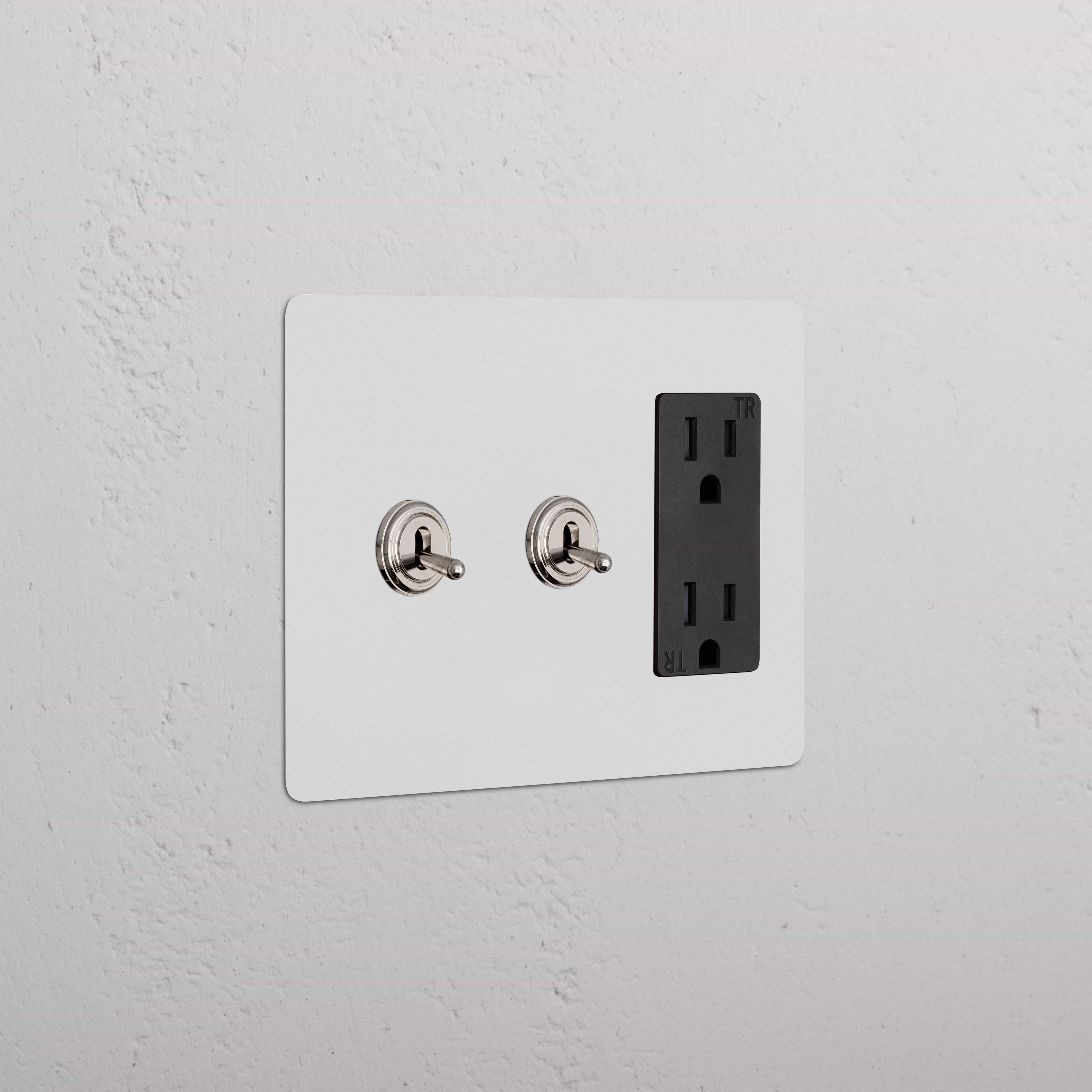 Kew 3G 2x Toggle Switch & Outlet in paintable polished nickel and black; two toggles and one black outlet.