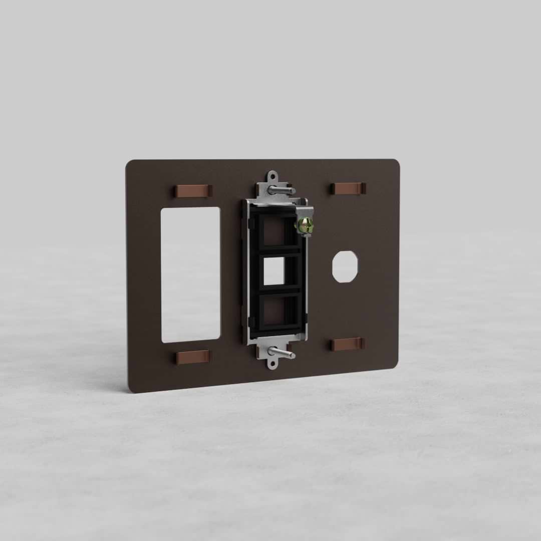Bronze 3-gang outlet, keystone, and switch plate (Kew US) with multiple openings for wiring and controls.
