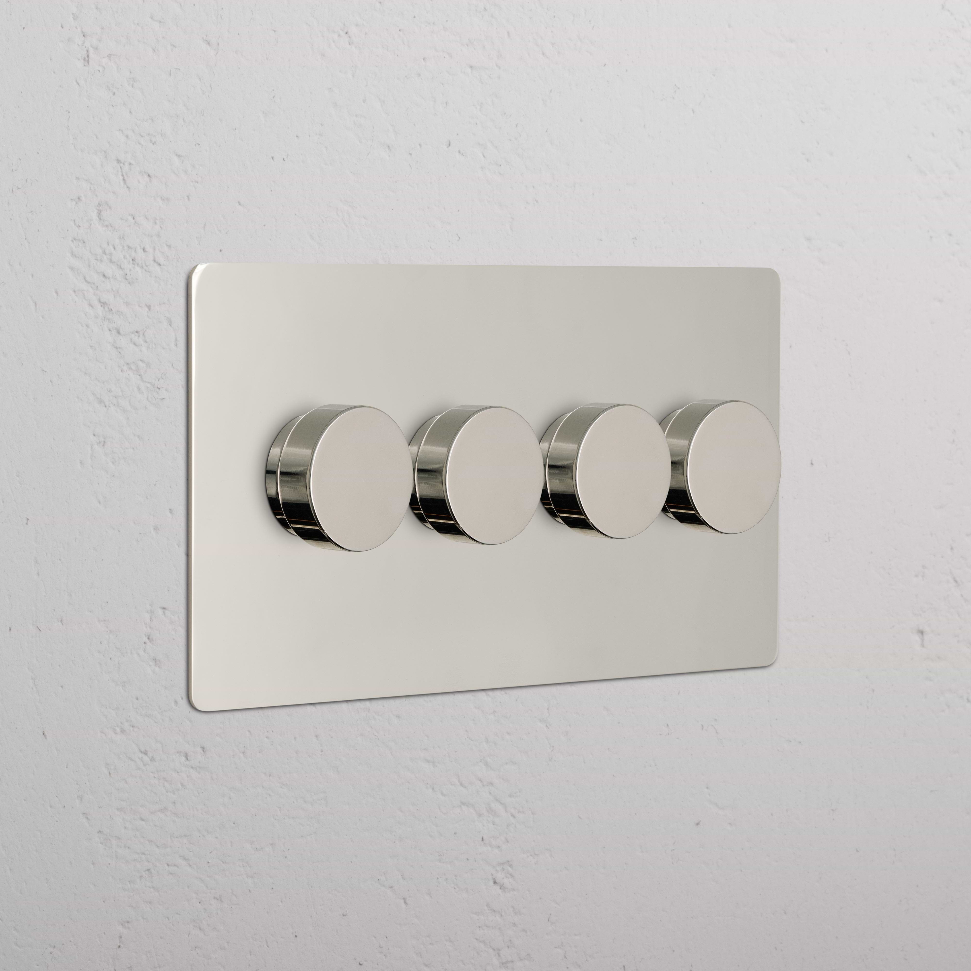 Kew 4G Dimmer Switch in polished nickel finish with four round knobs on a white wall.