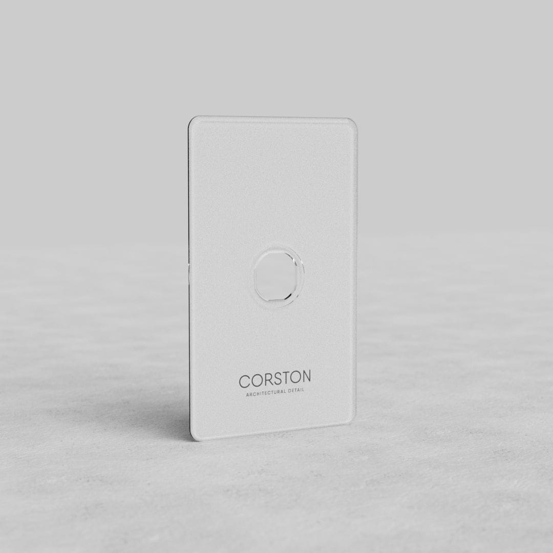 Clear 1-gang Kew US switch plate with central opening, featuring 'CORSTON' branding below.