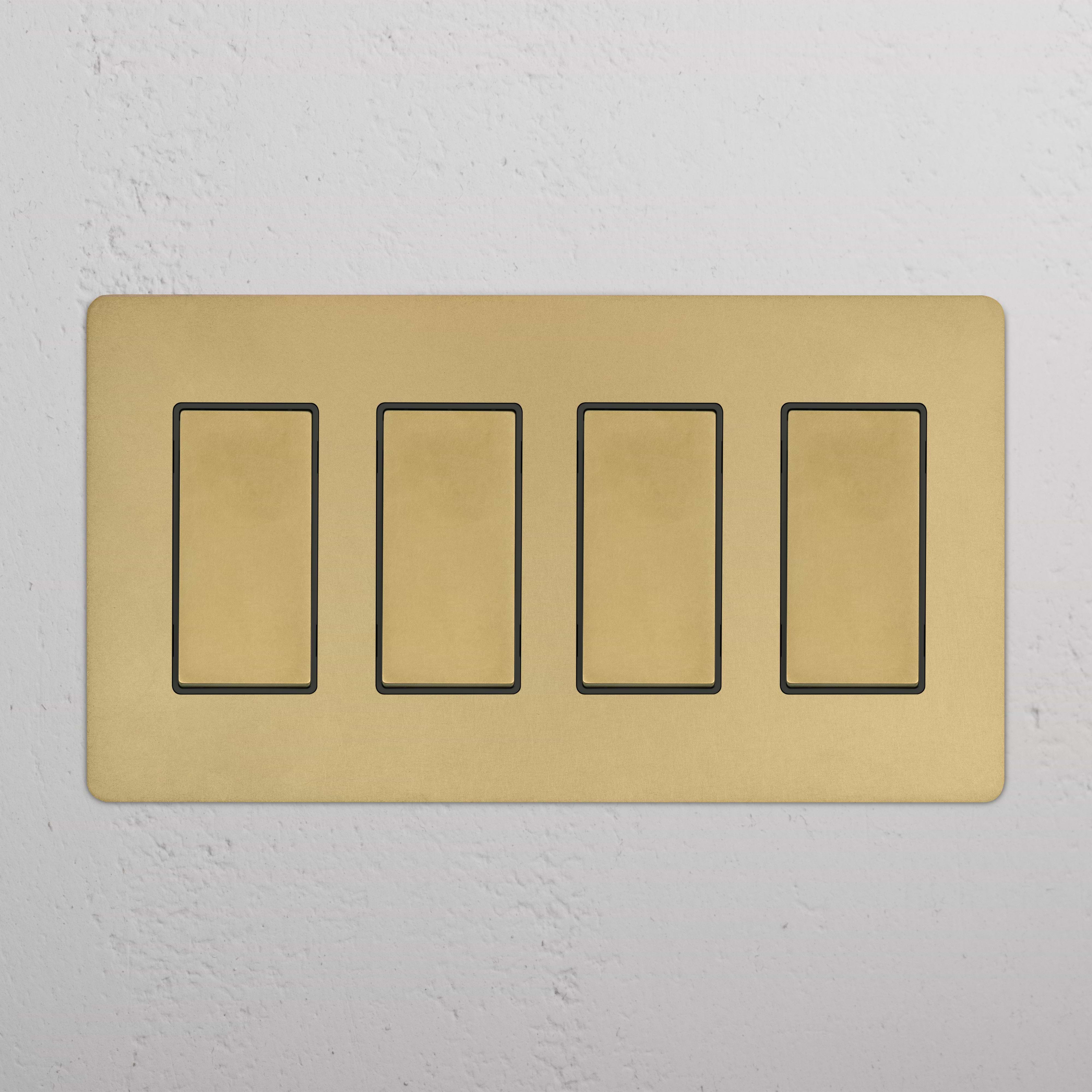 Kew 4G Rocker Switch in Antique Brass Black with four horizontal switches on a gold-colored plate.