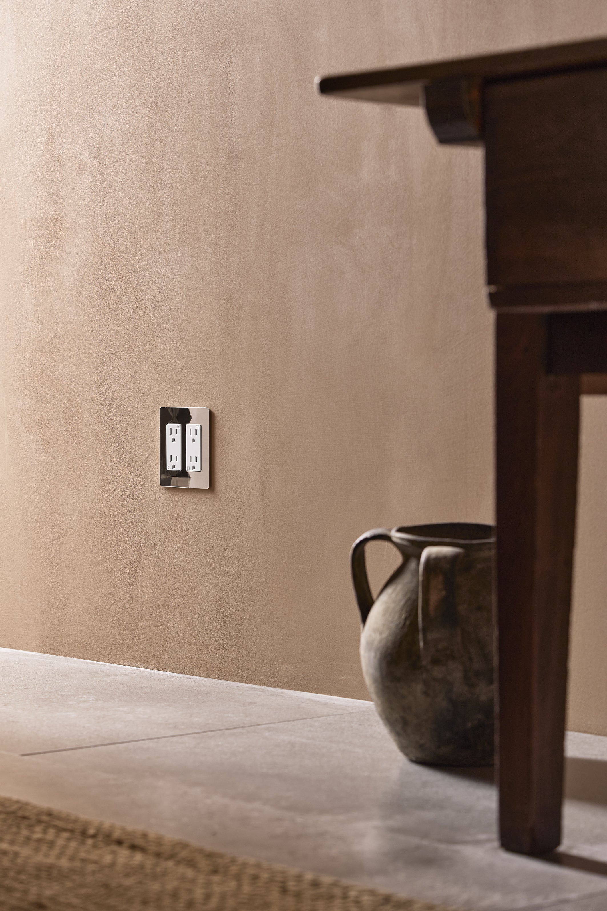 Kew 2G Outlet in polished nickel and white finish, double electrical socket on a plain wall.