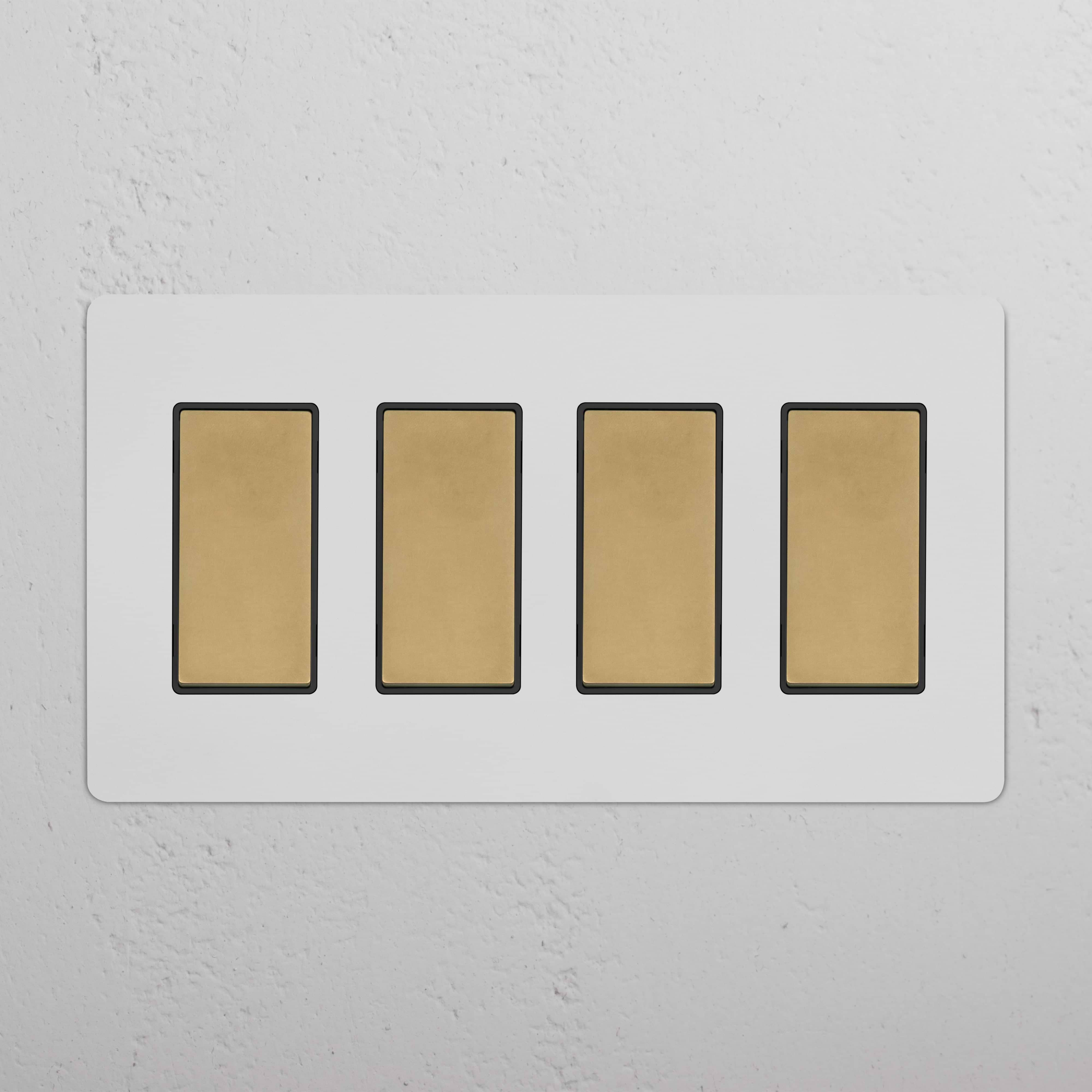 Kew 4G Rocker Switch in paintable antique brass black with four gold-colored rocker switches on a wall plate.