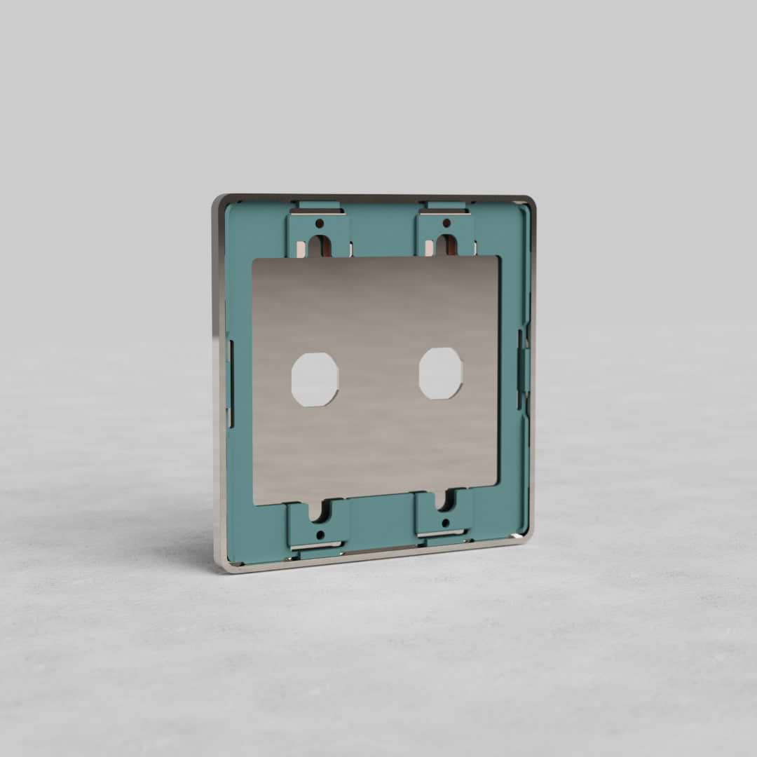 Polished nickel 2G Switch Plate Grove US with two rectangular switch openings, teal inner frame, on light background.