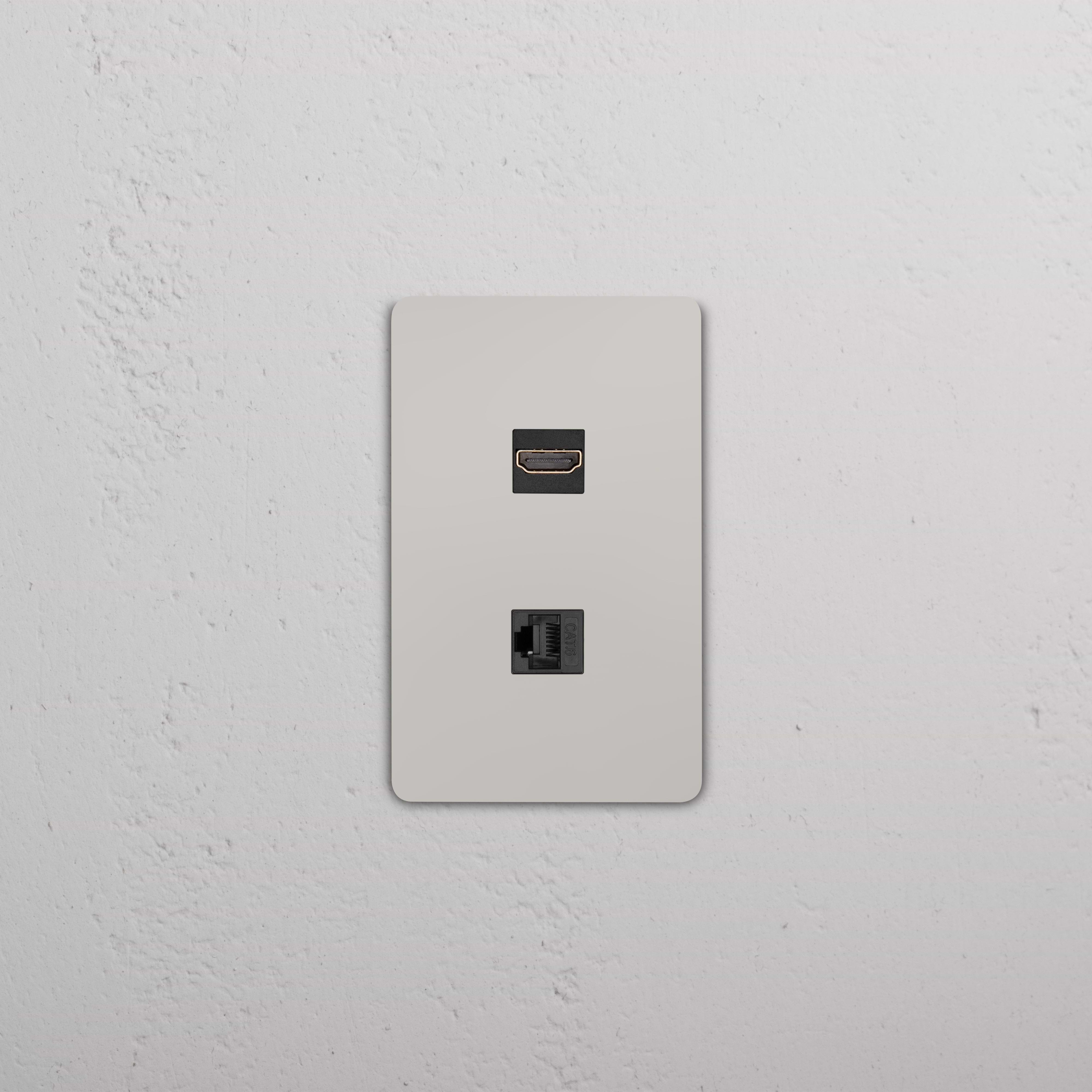 Grove 1G HDMI & CAT 6 Keystone wall plate in Antique Brass Black with HDMI and Ethernet ports.