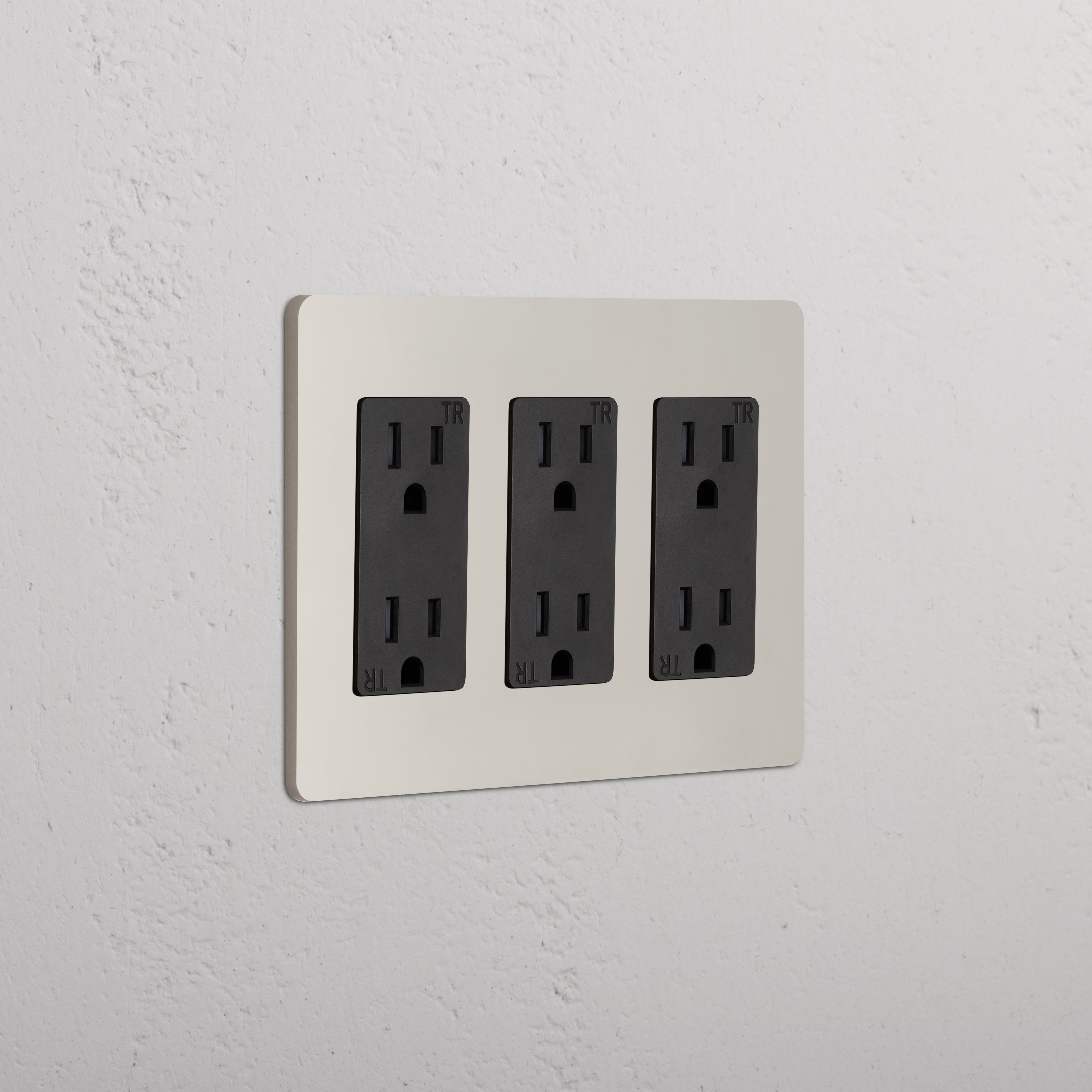 Grove 3G Outlet in Polished Nickel Black finish with three black duplex electrical outlets on a white wall plate.