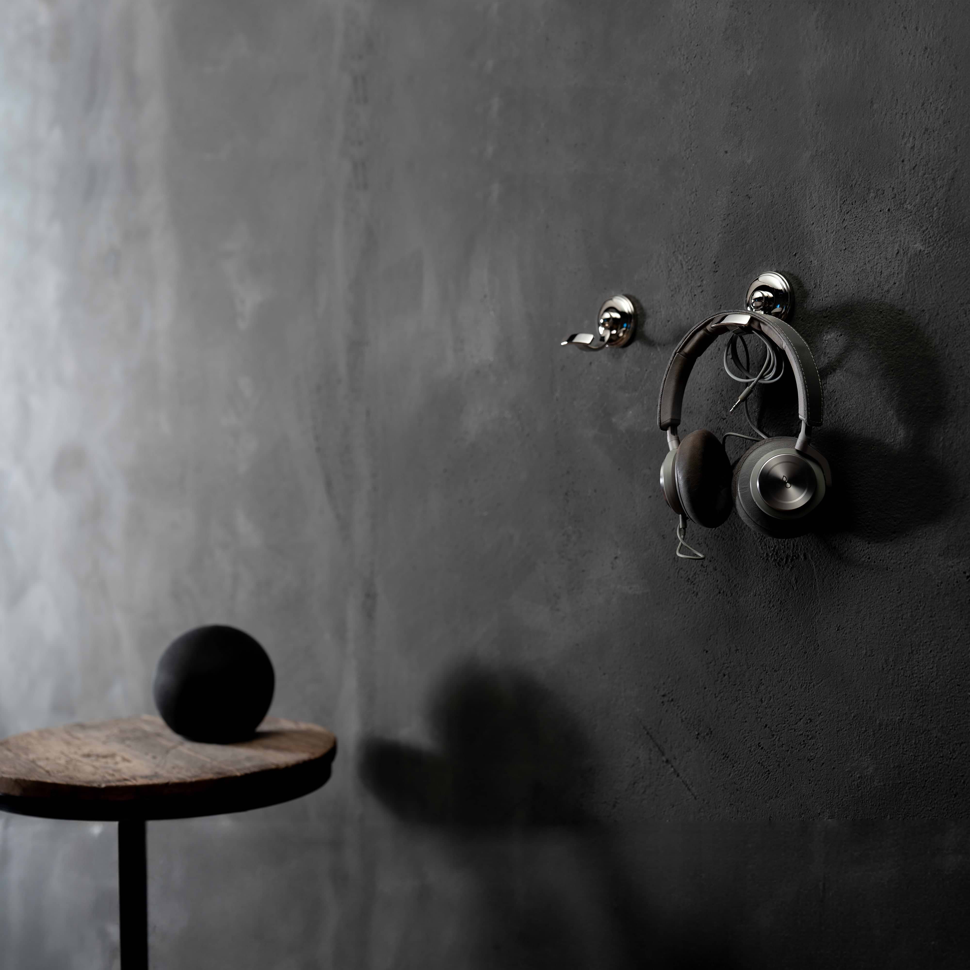 Polished nickel Portland Hook mounted on a gray wall, shown with and without items hanging.