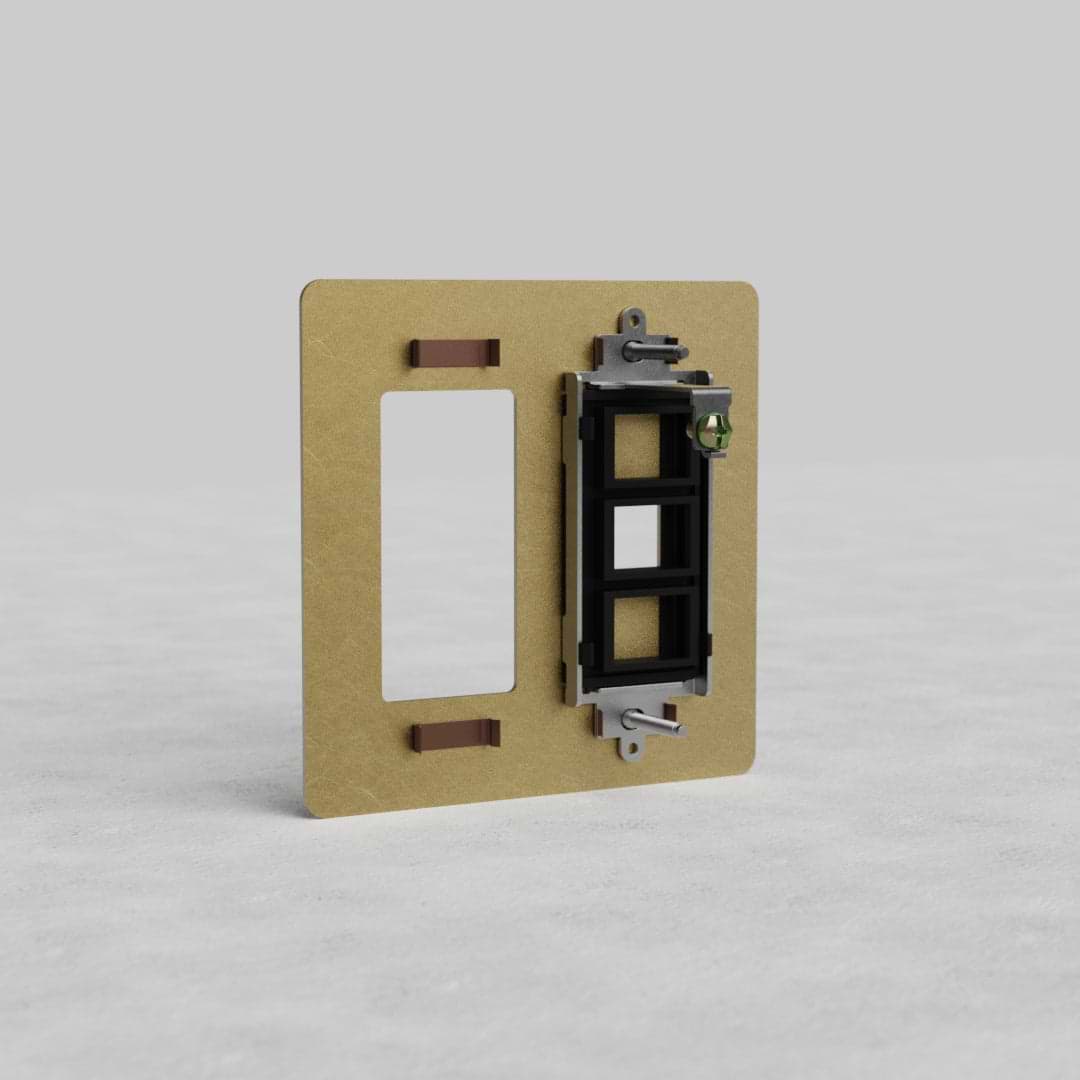 Antique Brass 2G Outlet & Keystone Plate Kew US with dual outlet openings on a light grey surface.