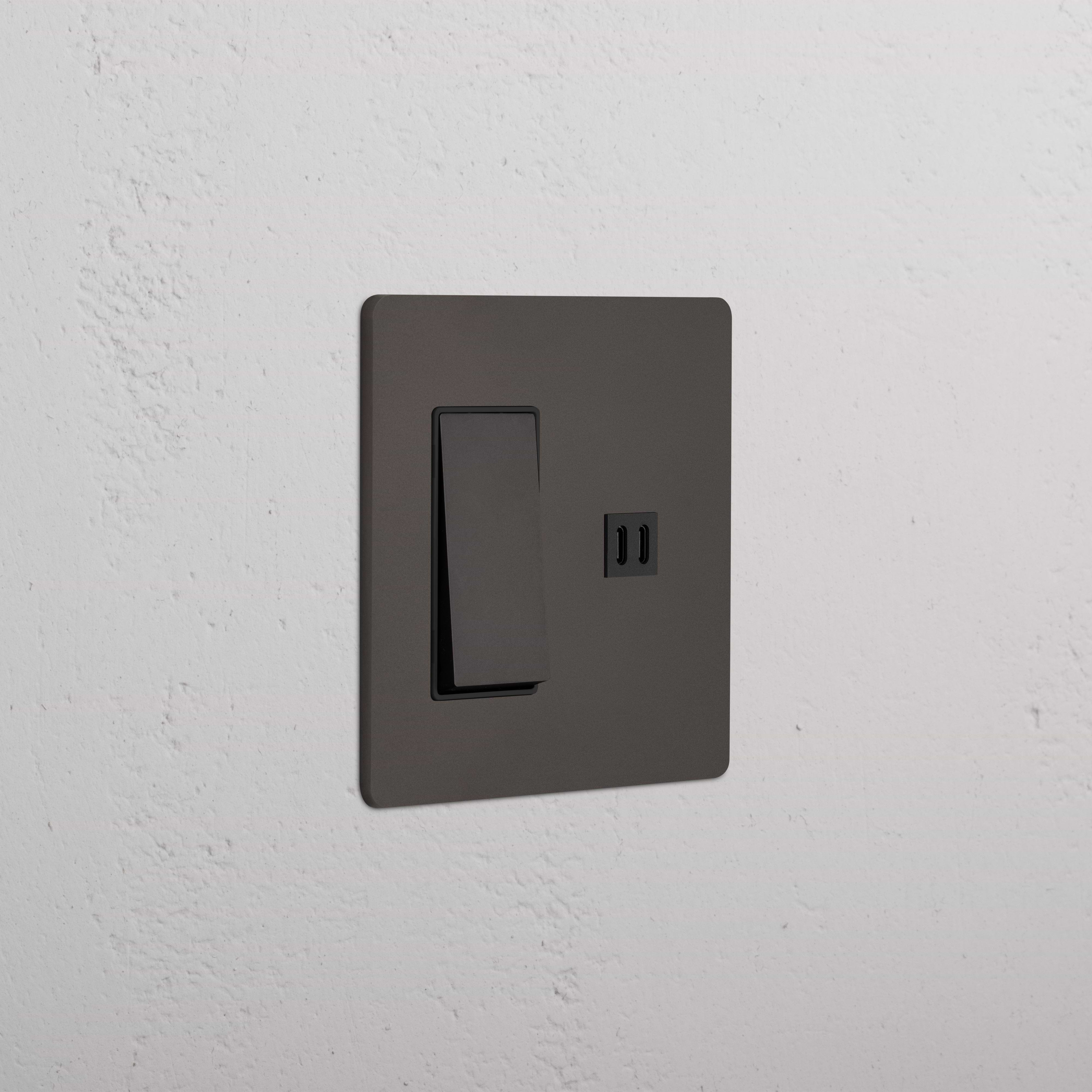 Grove 2G Rocker Switch and Fast Charge USB in Bronze Black with a sleek rectangular design, wall-mounted.