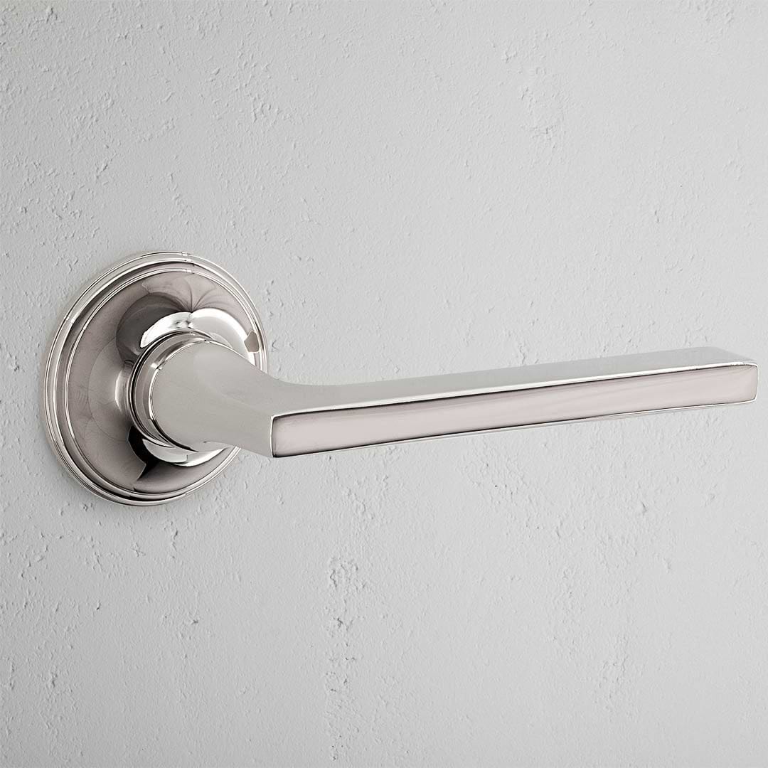 Polished Nickel Clayton Unsprung Passage Door Handle Set with rectangular lever on round base plate.