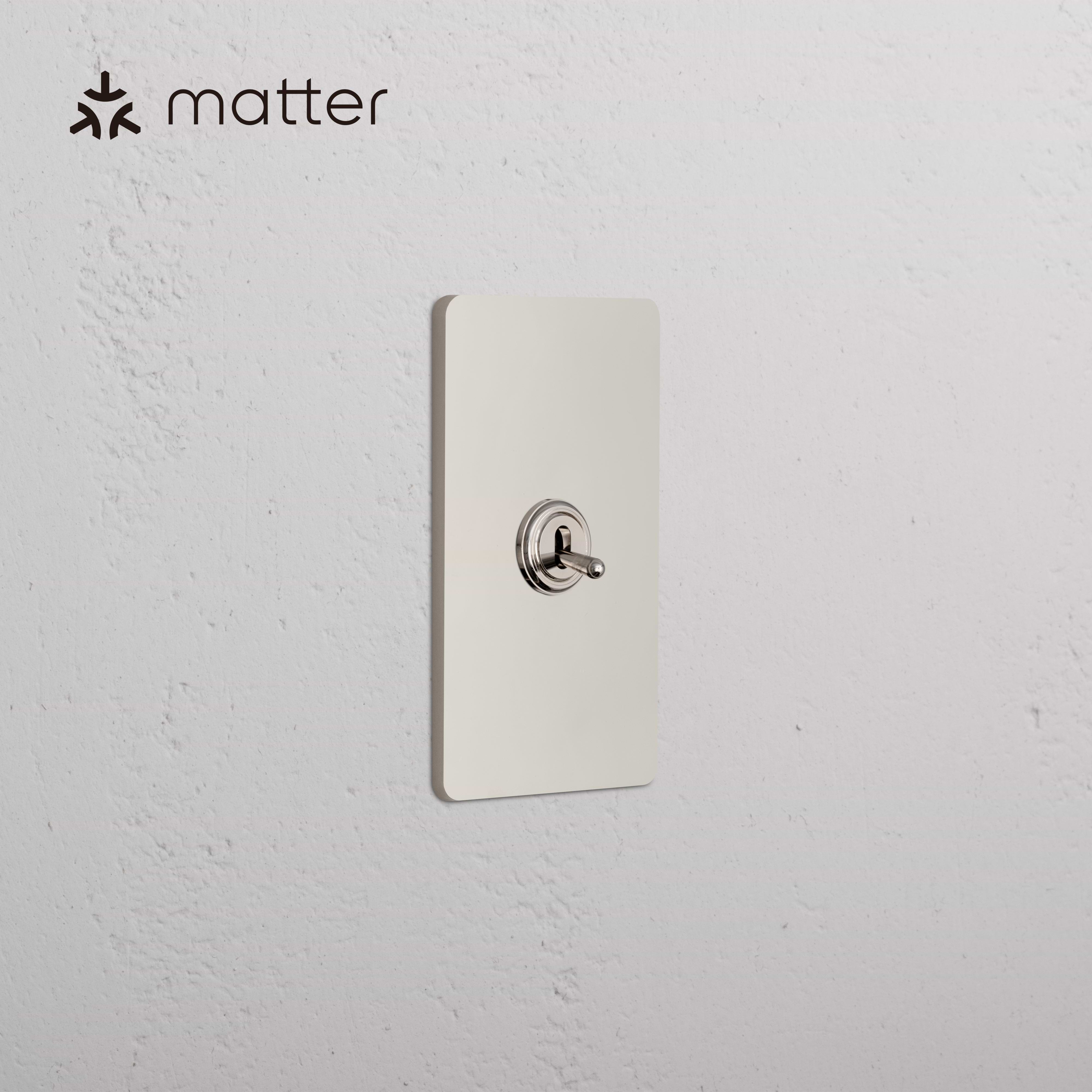 Grove 1G Smart Retractive Toggle Switch in Polished Nickel, single rectangular plate with toggle switch.