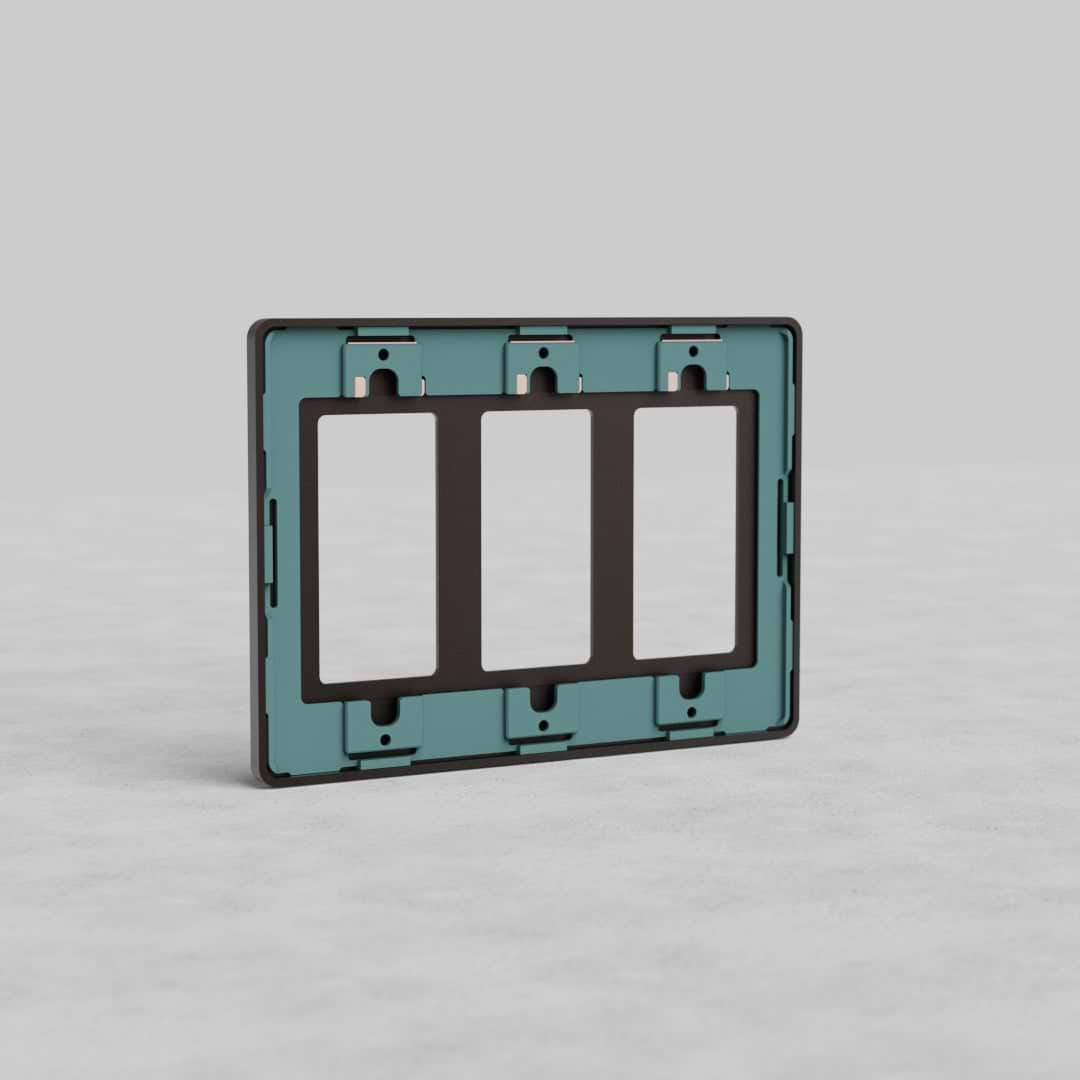 Rectangular bronze 3G Outlet Plate Grove US with three vertical outlet openings, shown on a light gray surface.