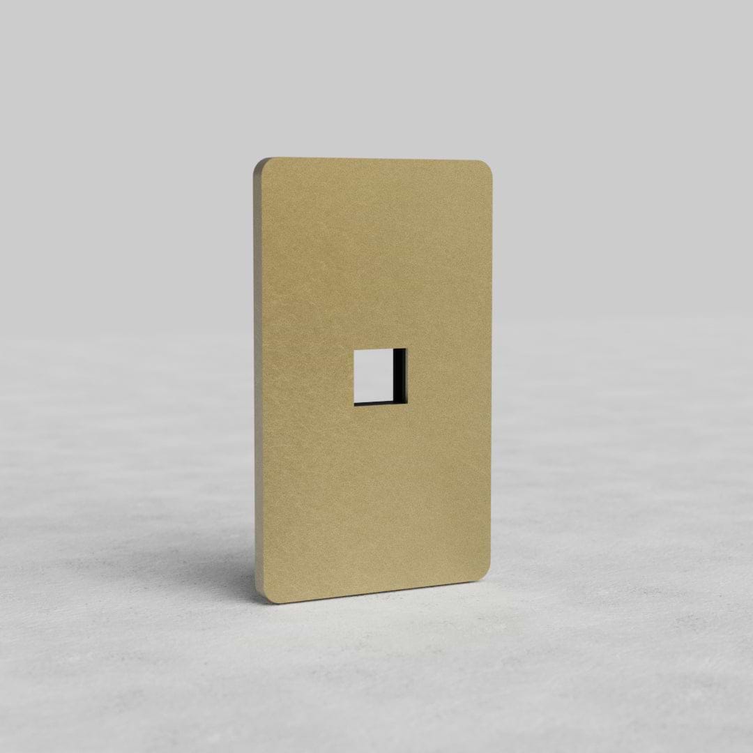 Antique brass 1G Keystone Plate Grove US with a central keystone opening, shown upright on a neutral background.