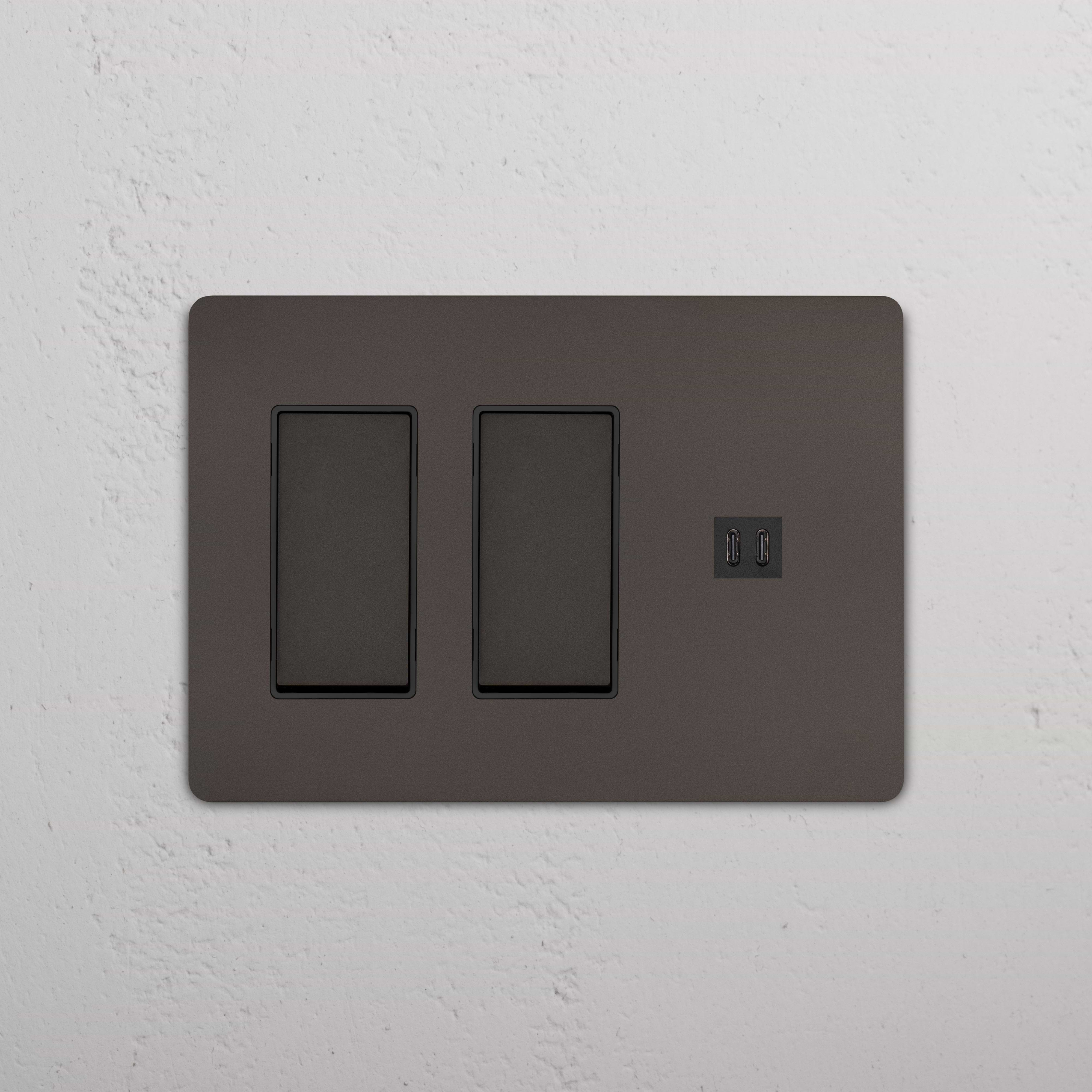 Grove 3G 2x Rocker Switch & Fast Charge USB in Bronze Black, with two switches and dual USB ports on a wall.
