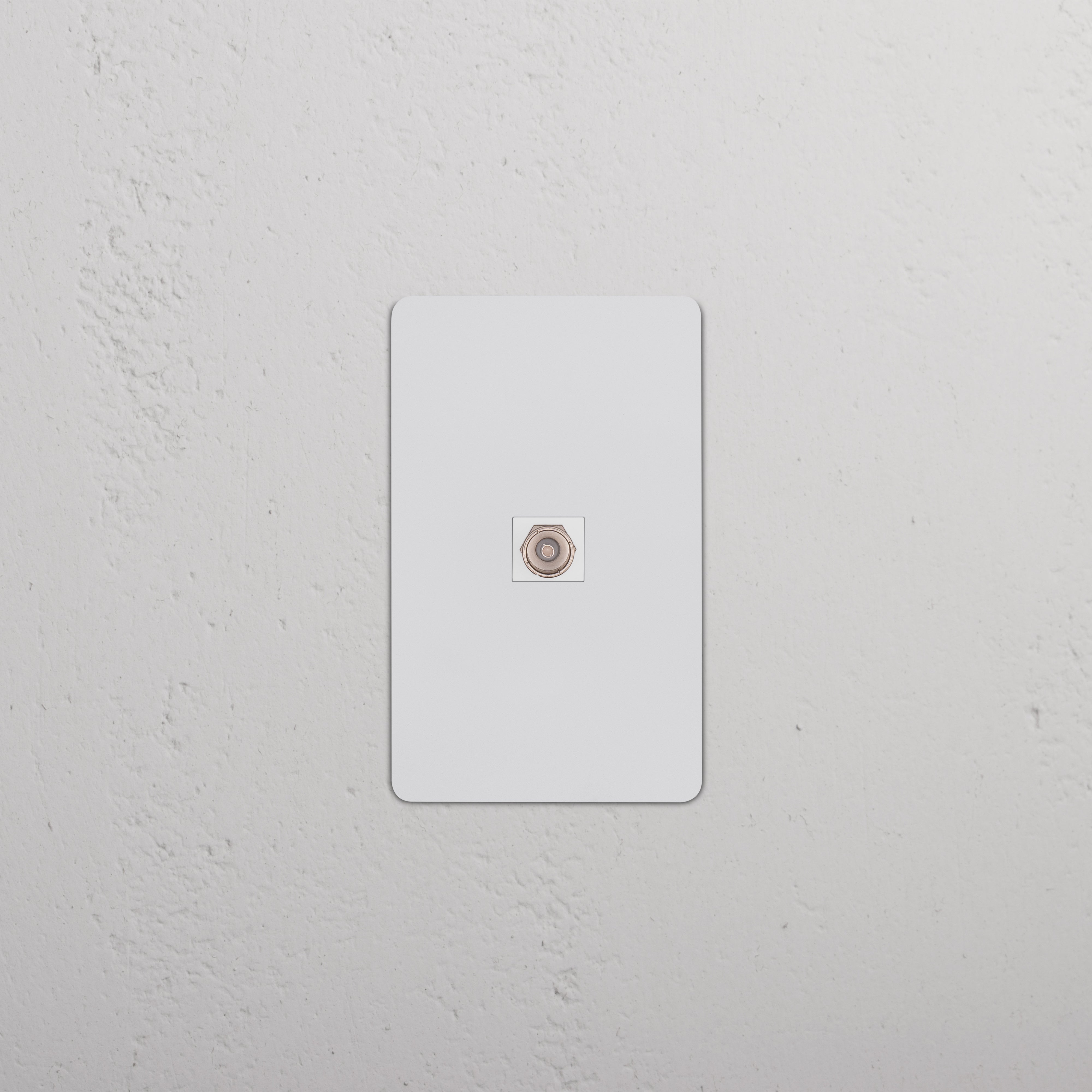 Kew 1G TV Keystone paintable white wall plate with central TV socket, shown mounted on a white wall.