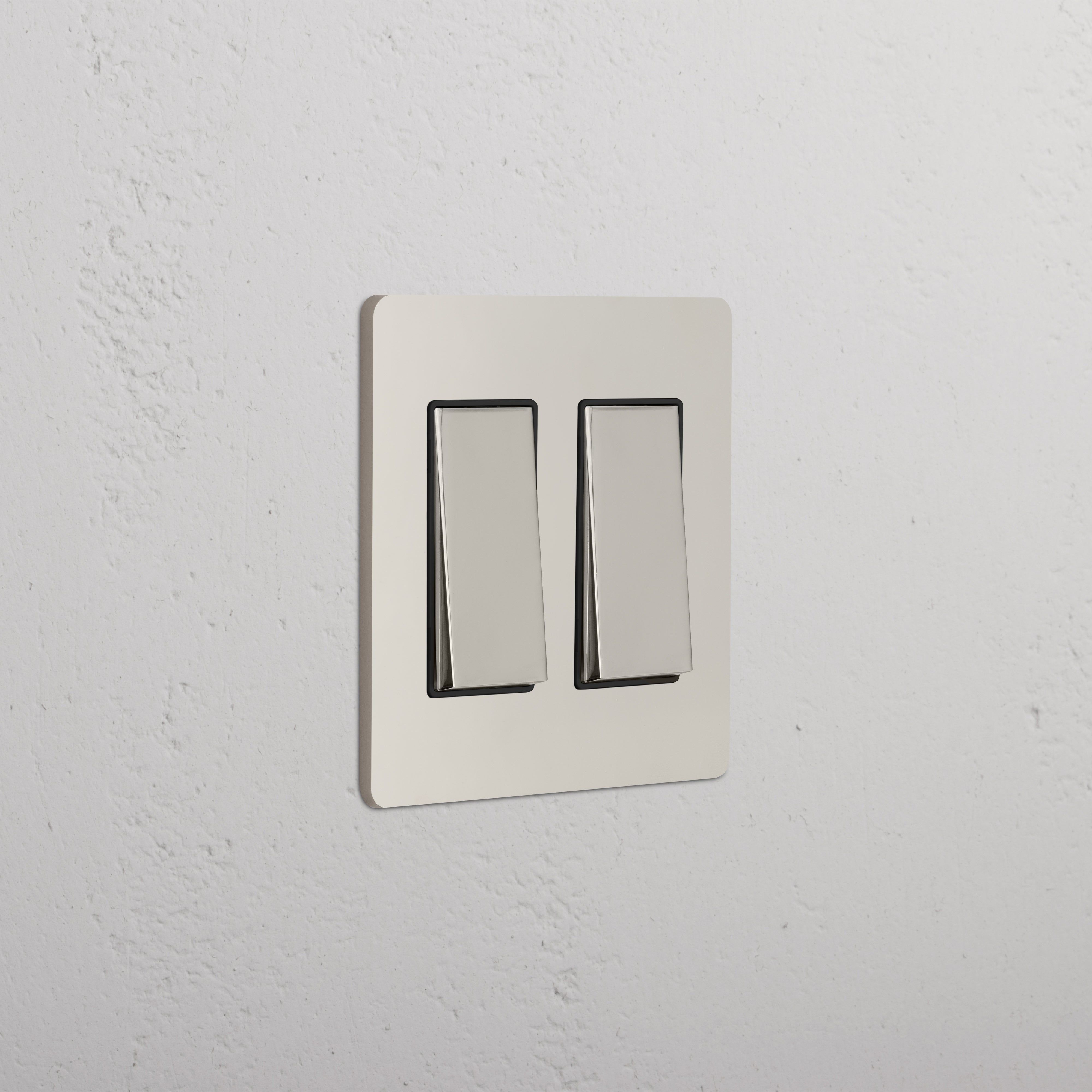 Grove 2G Rocker Switch in polished nickel black finish, featuring two rocker switches on a wall plate.