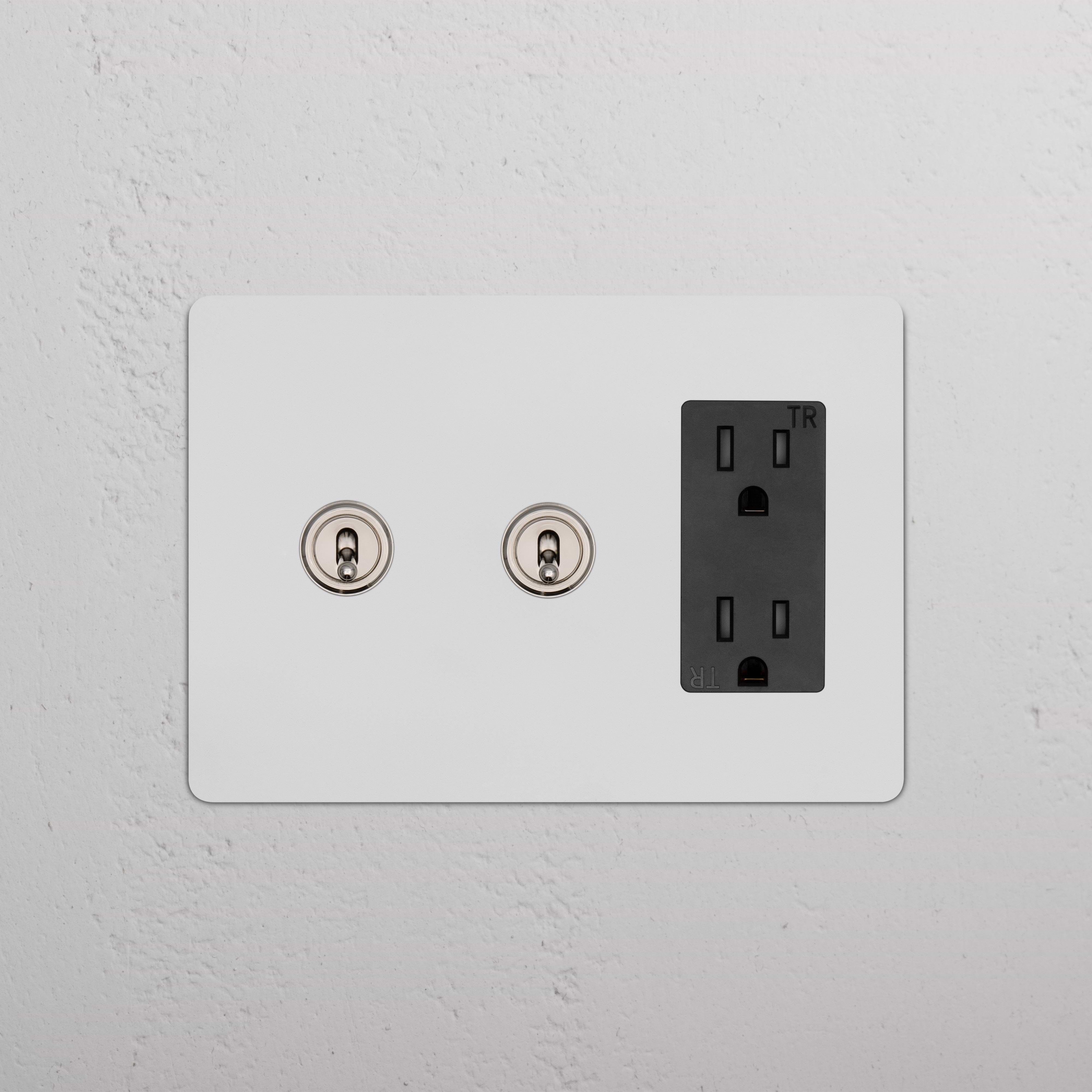 Kew 3G 2x Toggle Switch & Outlet in paintable polished nickel and black, with two toggles and a three-slot outlet.