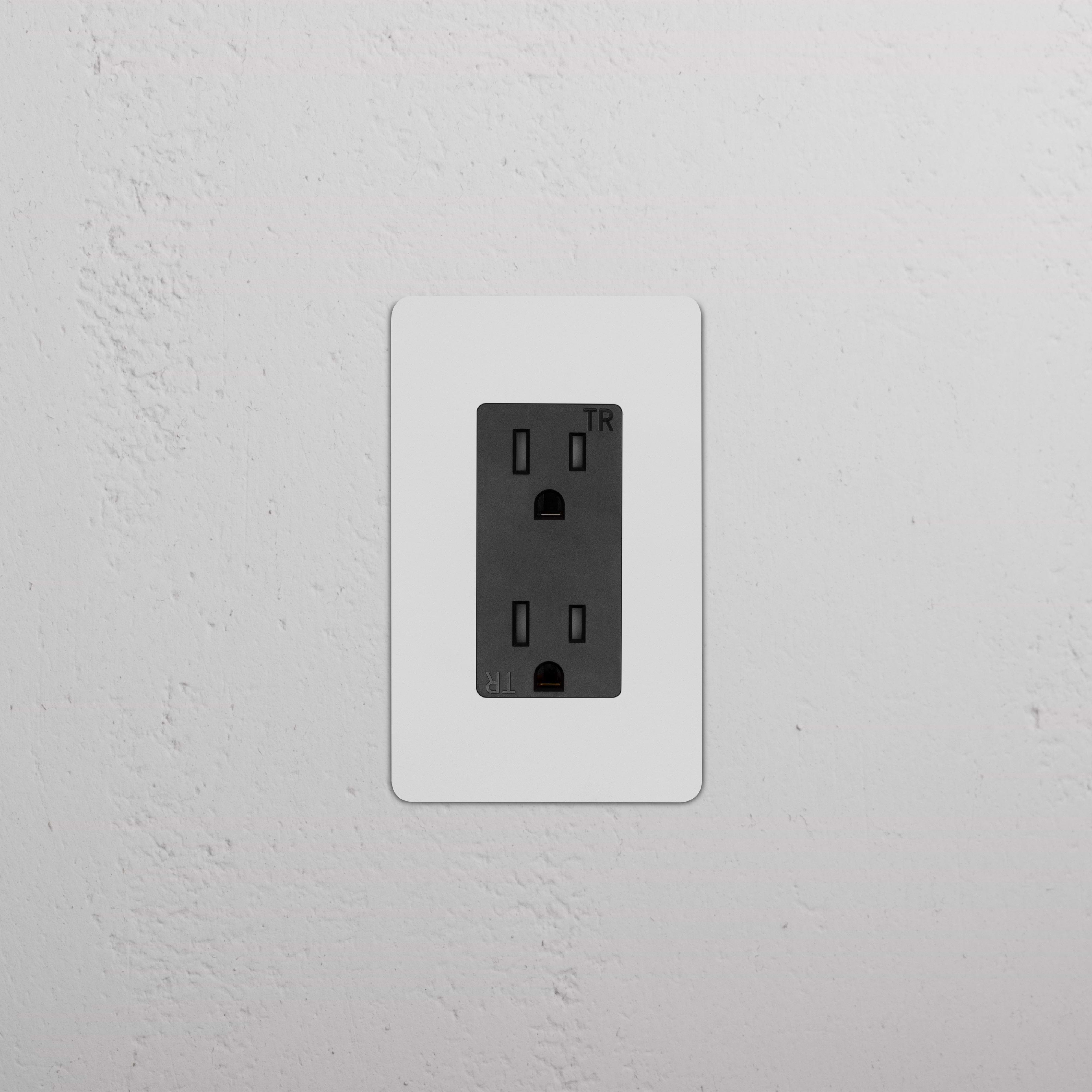Kew 1G 15A electrical outlet in paintable black finish with single socket and sleek, modern design.