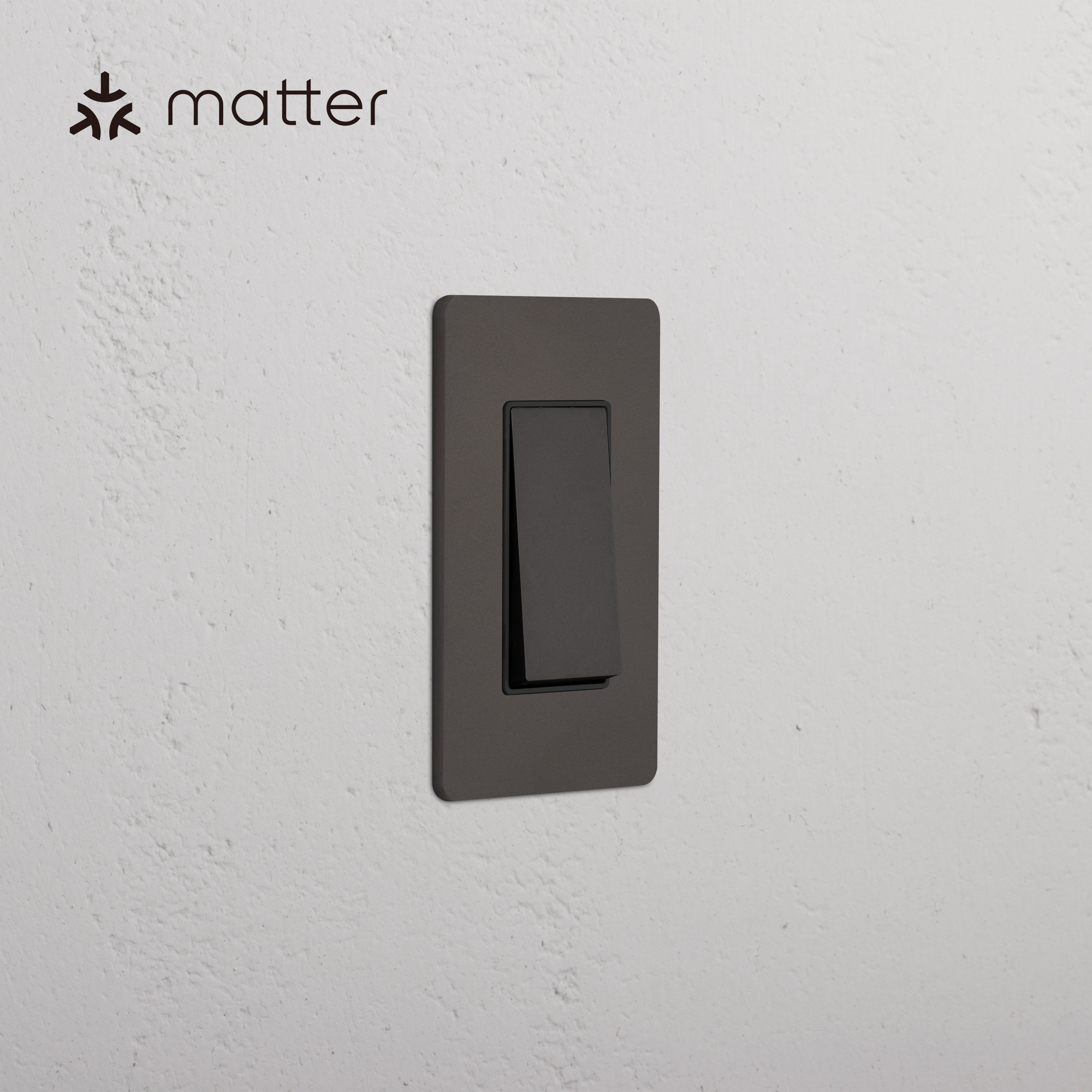 Grove 1G Smart Retractive Rocker Switch in Bronze Black, with Matter logo shown in the corner.