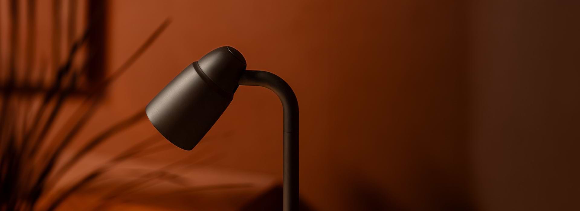 Bronze pendant wall light with fluted glass by Corston bedside