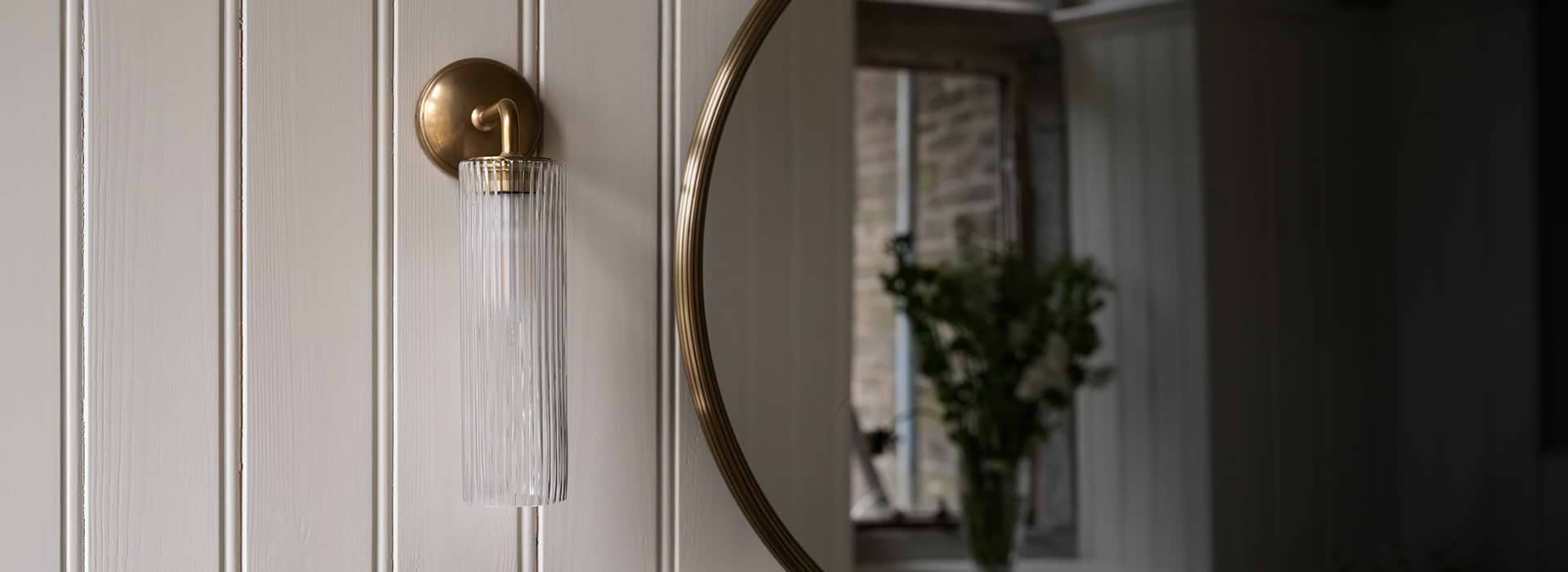 Bronze Wall light with fluted glass on white wall