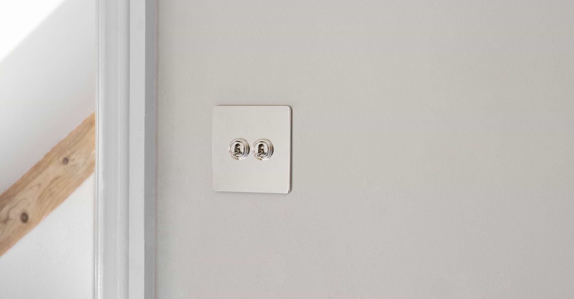 2 Toggle polished nickel switch in room