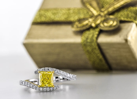 LEIBISH cross-over pave solitaire diamond ring setting, featuring a fancy intense yellow princess-cut diamond center stone mounted in platinum and 18K yellow gold