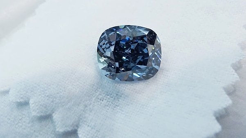 The 12.03 carat natural fancy vivid blue diamond with an IF clarity