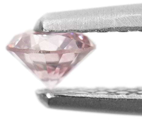 The laser inscribed serial number on an Argyle pink diamond